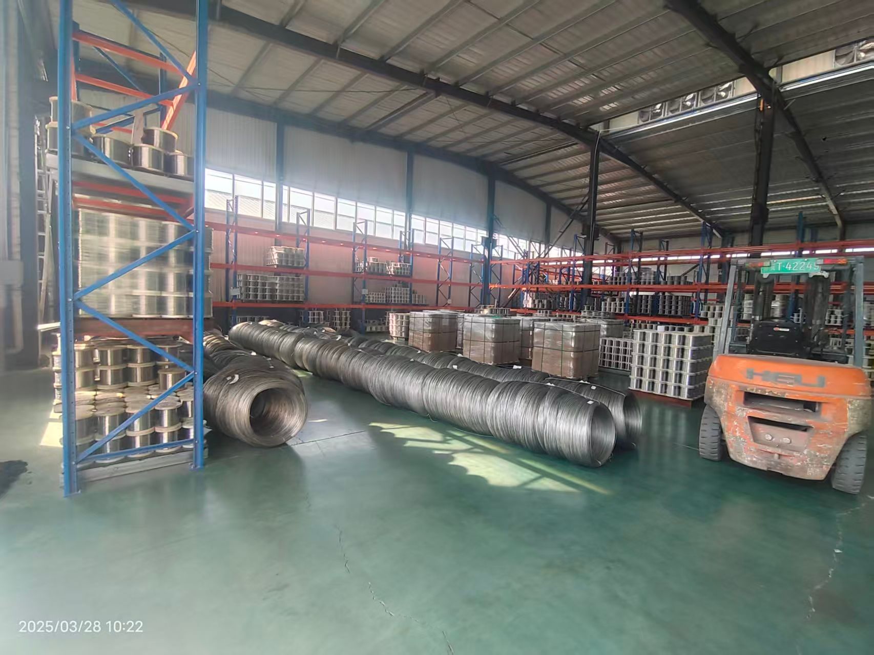 KAIFIL factory warehouse with stainless steel wire coils and forklift
