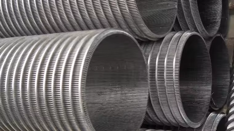 A stainless steel wedge wire screen cylinder used as a resin trap, showing continuous V-profile slots running the full length of the element