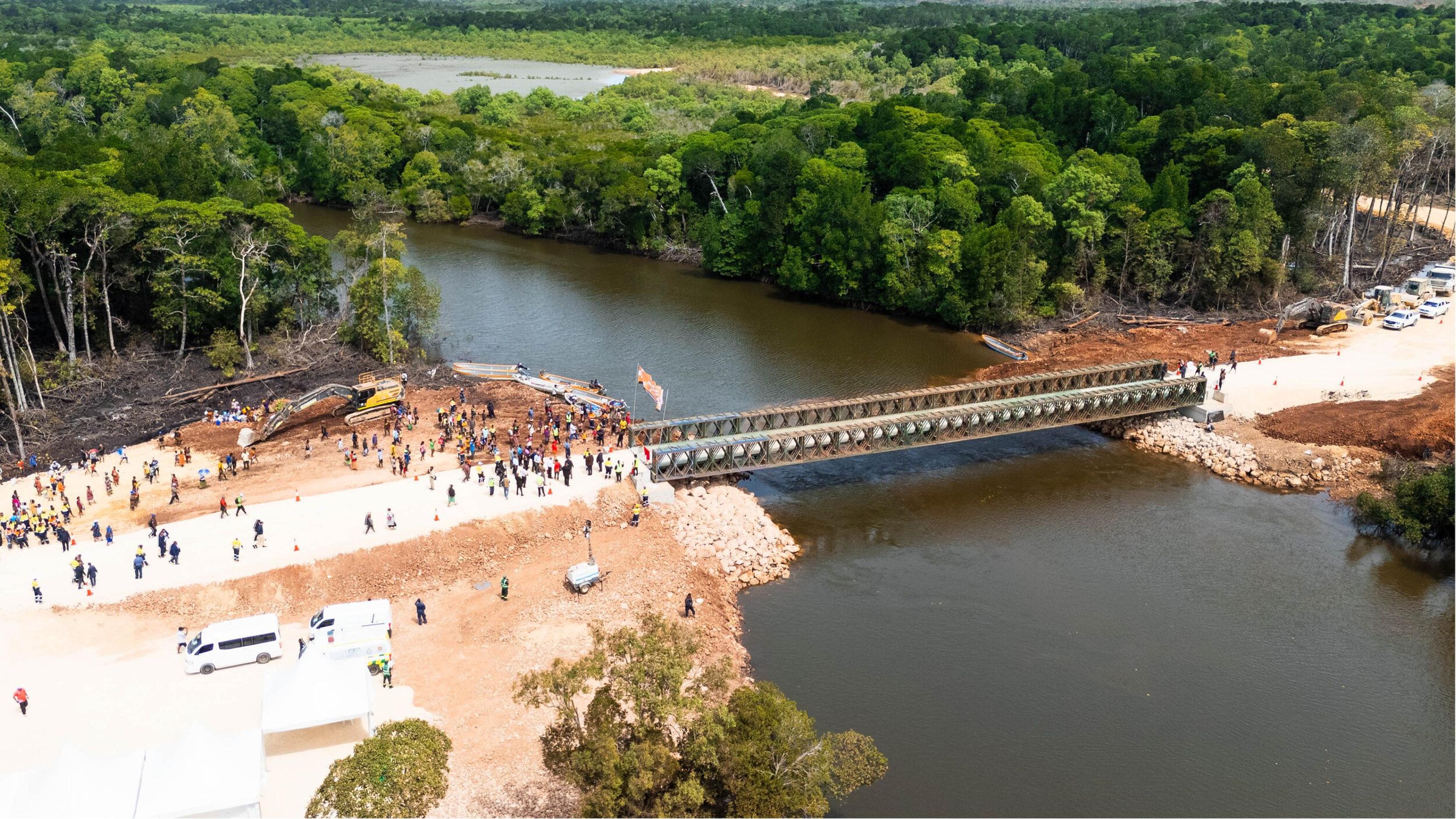 Community members gathered at the opening of a new bridge and access road