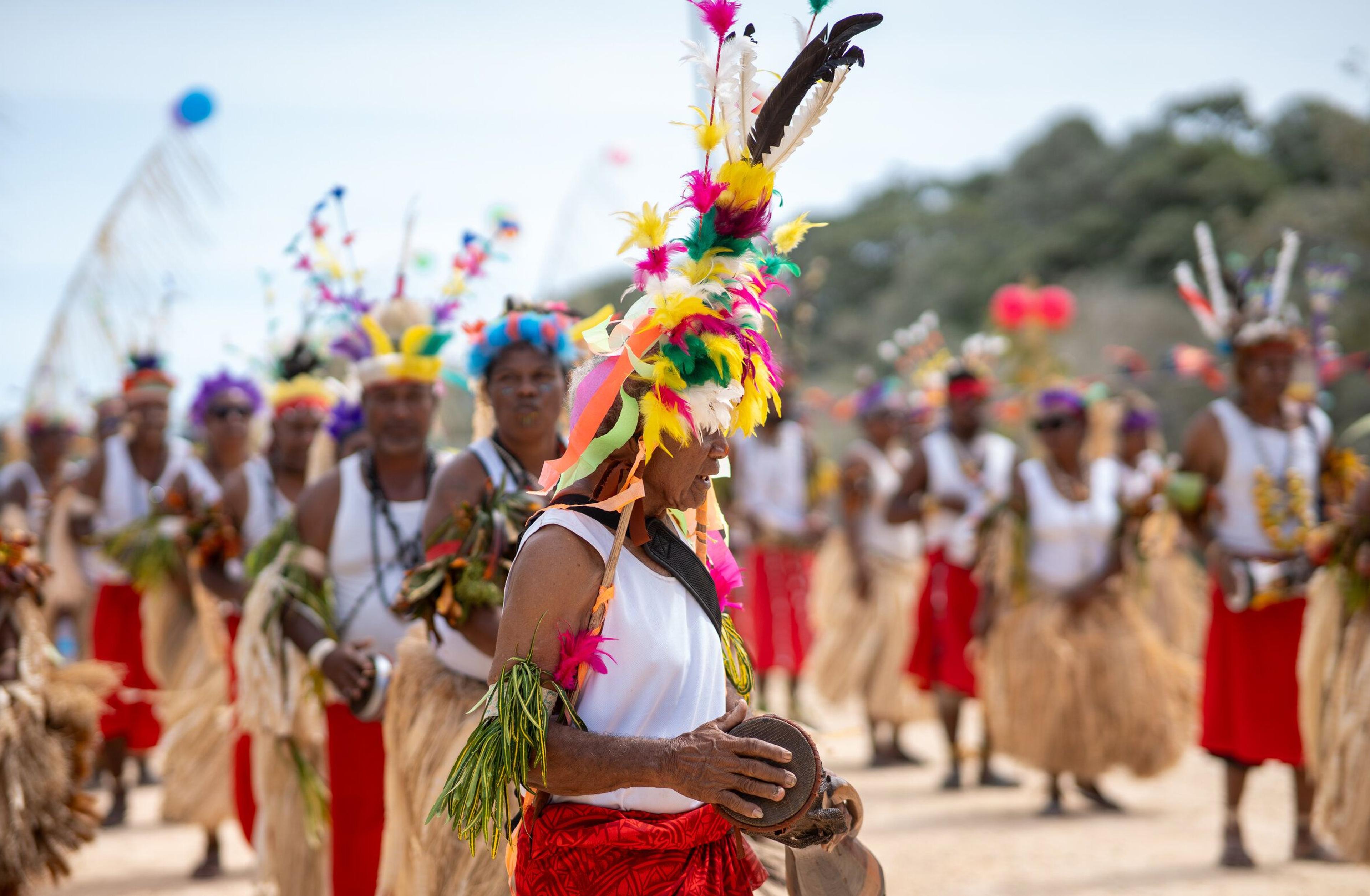 Papua New Guinean dancers in traditional dress at a Pacific Lime and Cement community event