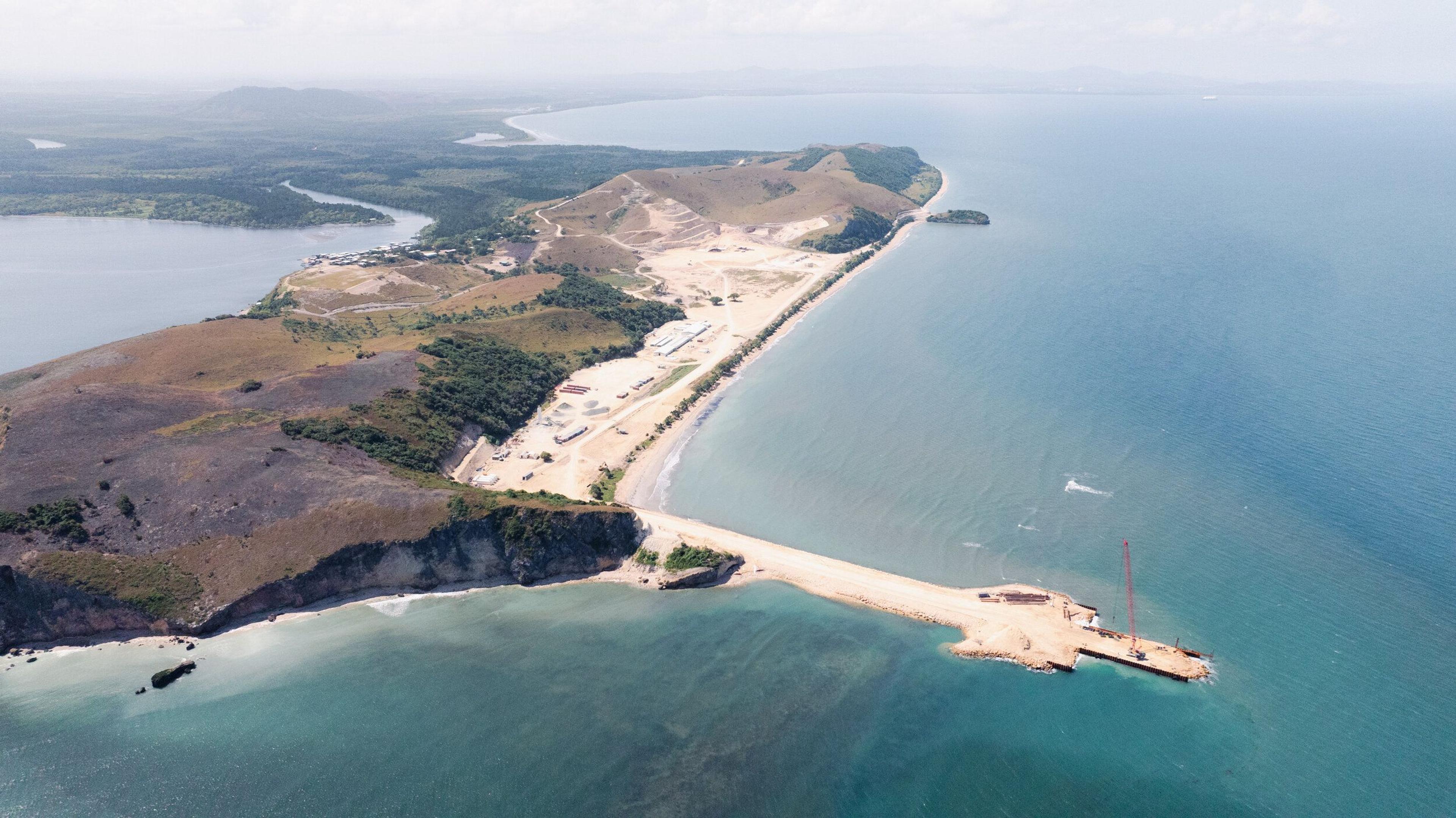 An aerial view of the coastal limestone deposits and the deep-water wharf