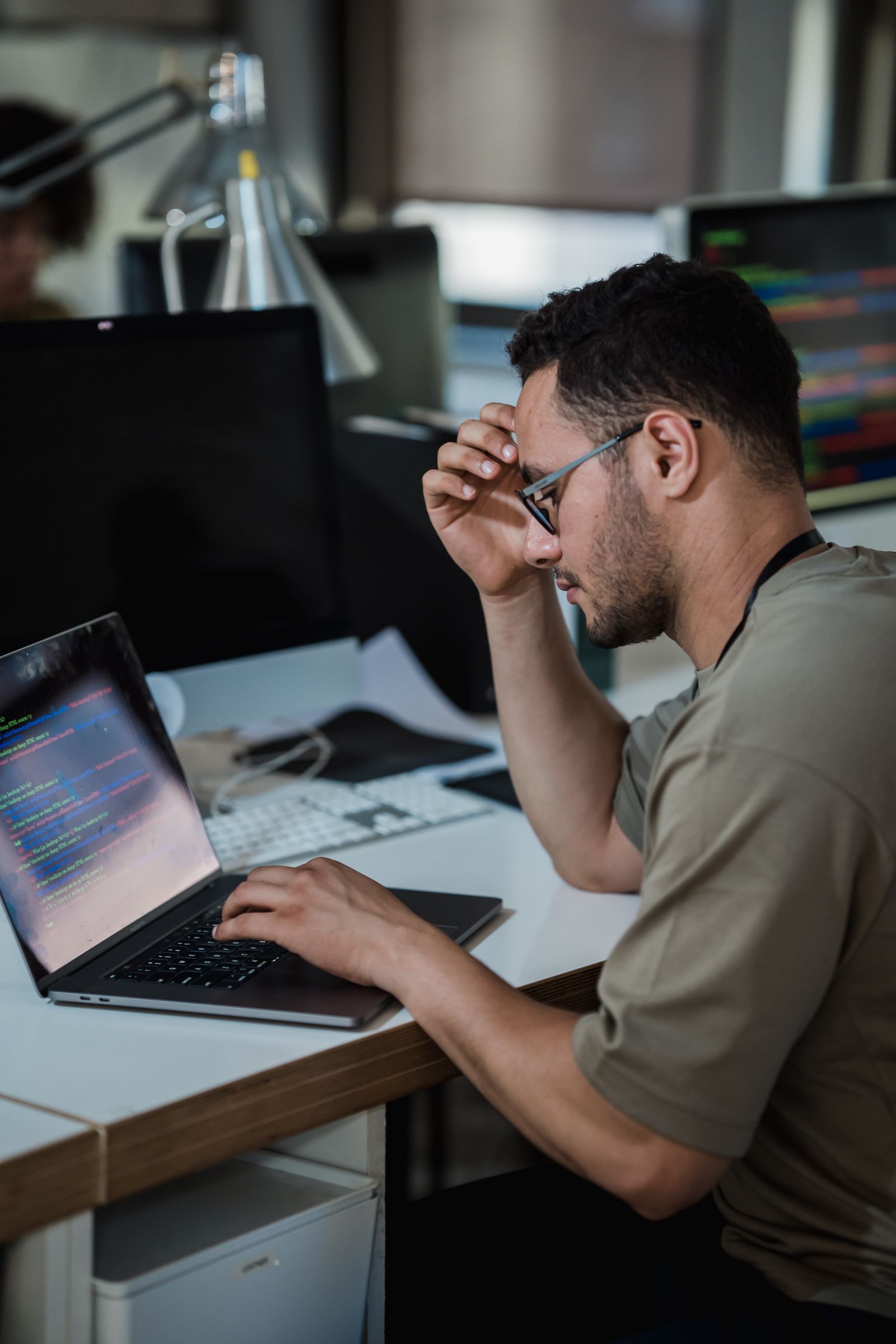 A developer focused on code at a desk
