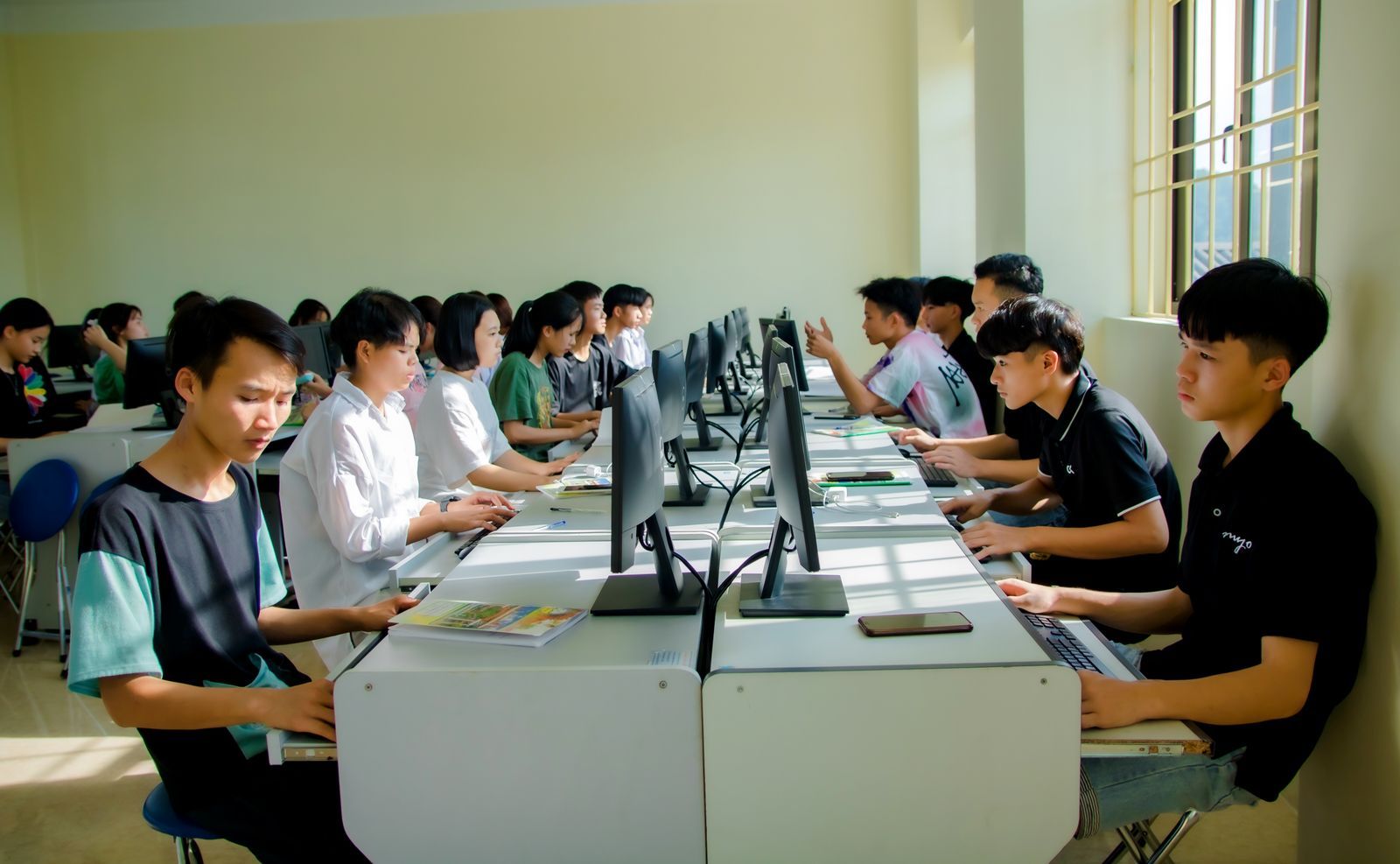 Students working at computers in a college lab