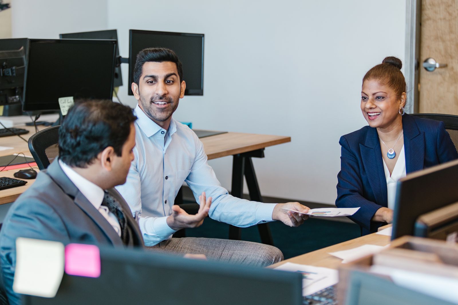 Colleagues in discussion in a modern office