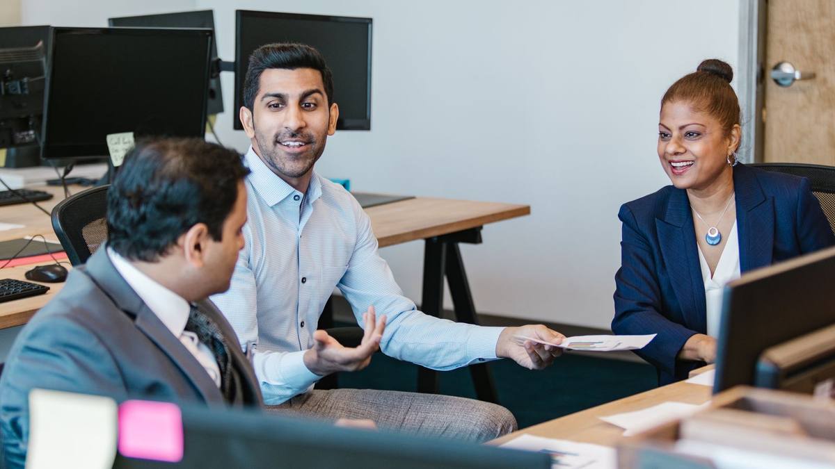 Colleagues in discussion in a modern office