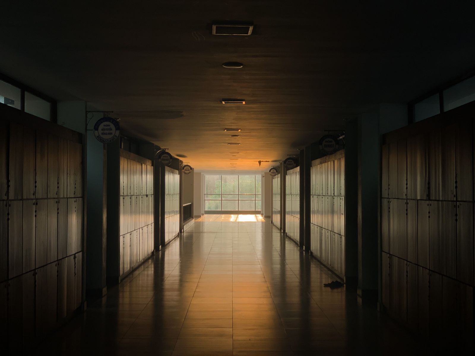 An empty college corridor lined with lockers