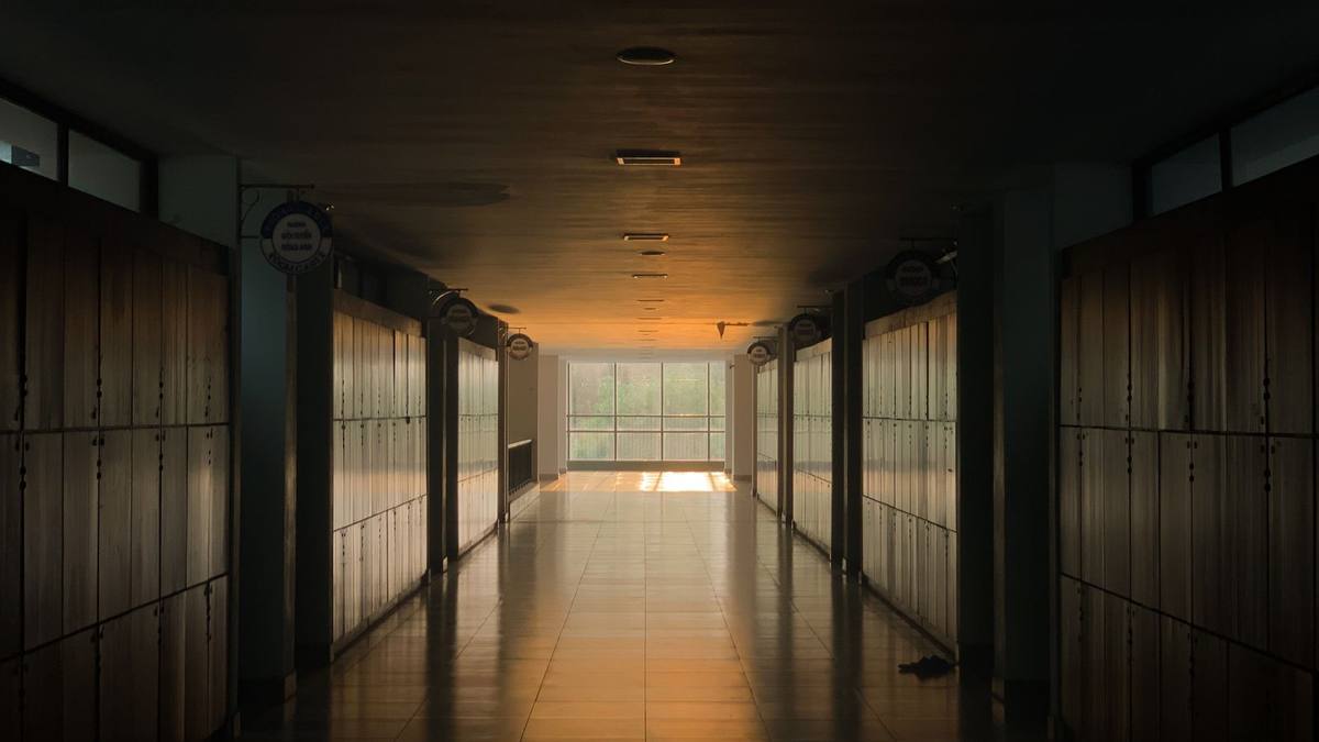 An empty college corridor lined with lockers