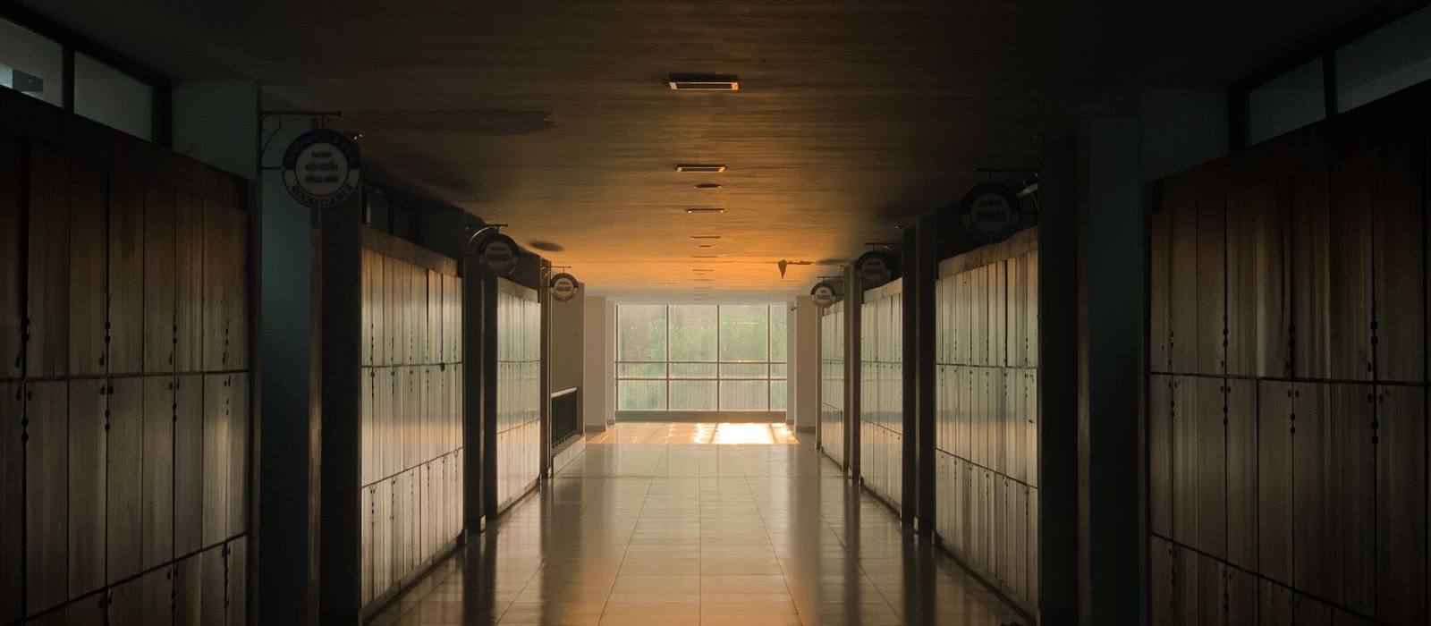 An empty college corridor lined with lockers