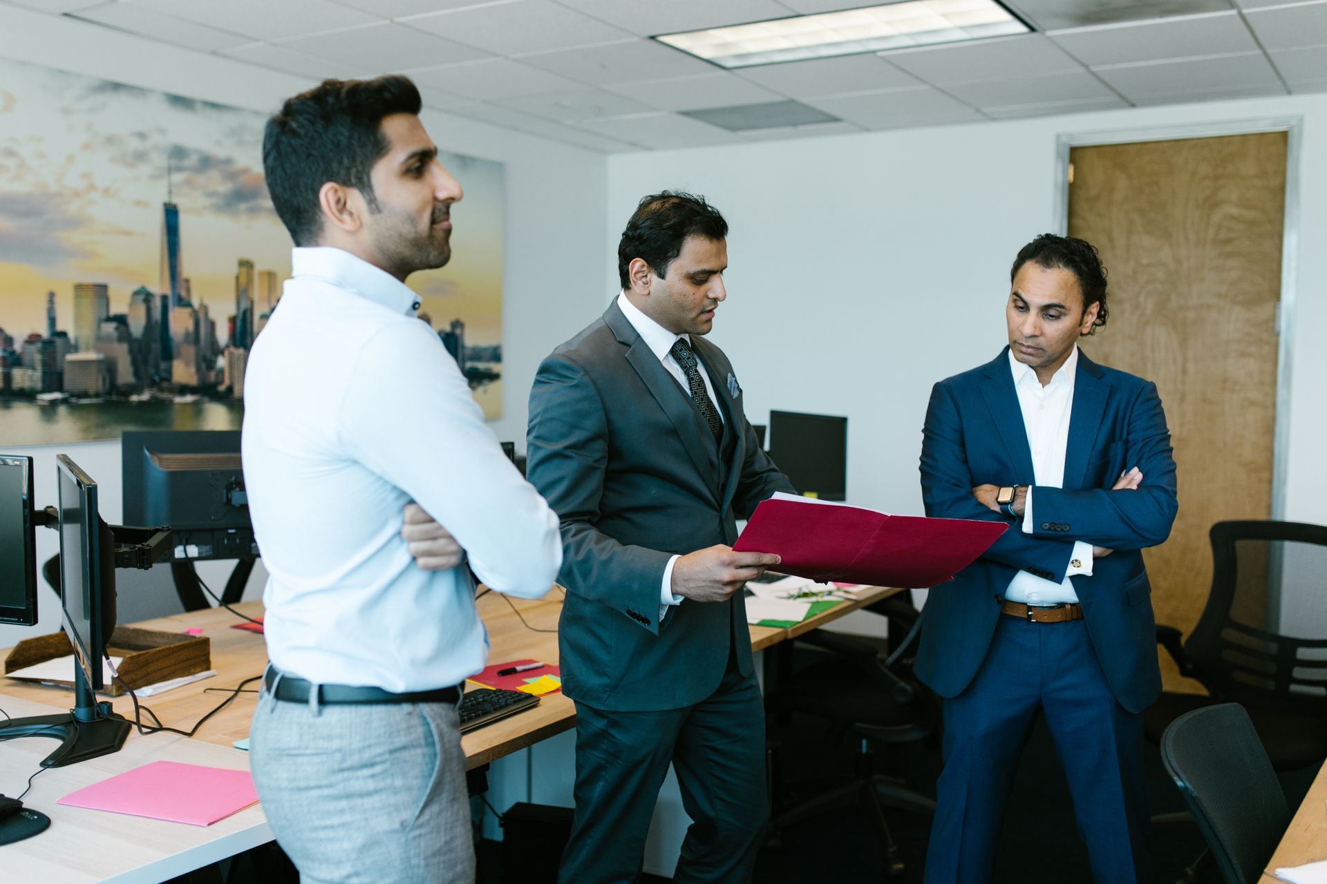 Colleagues reviewing documents together in an office