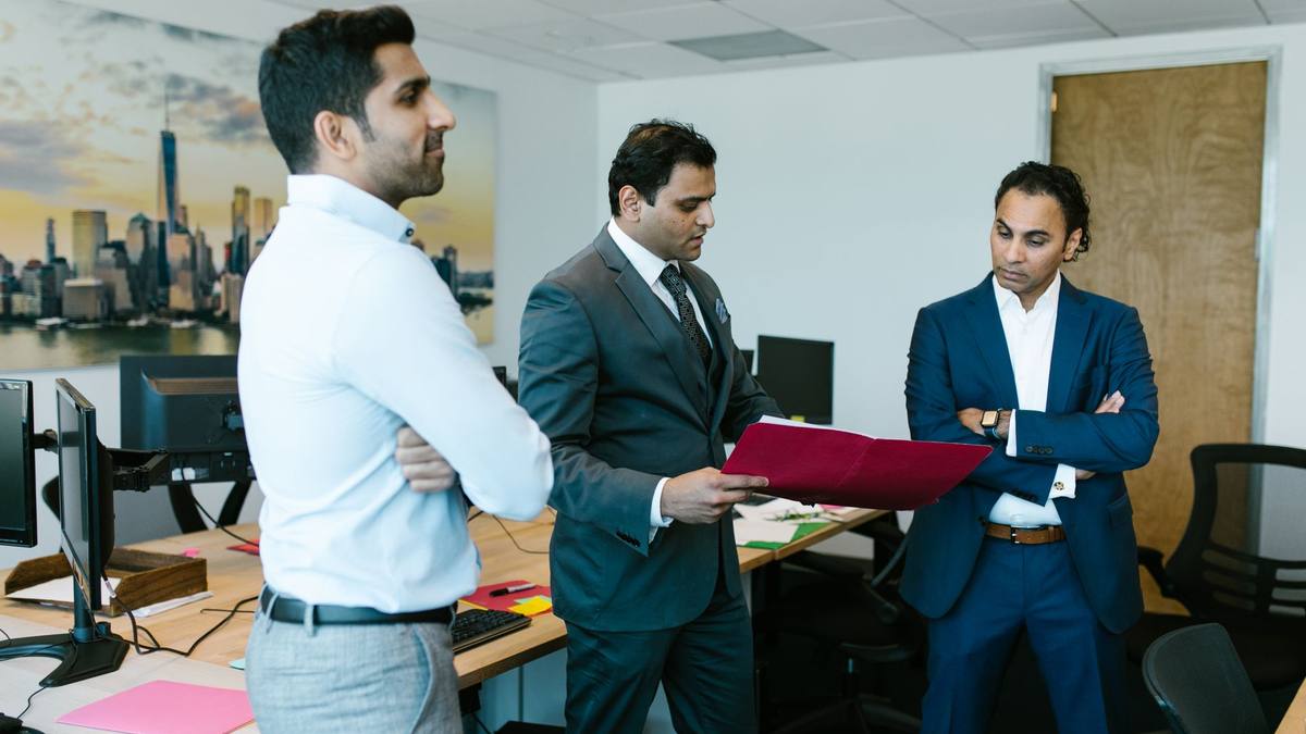 Colleagues reviewing documents together in an office