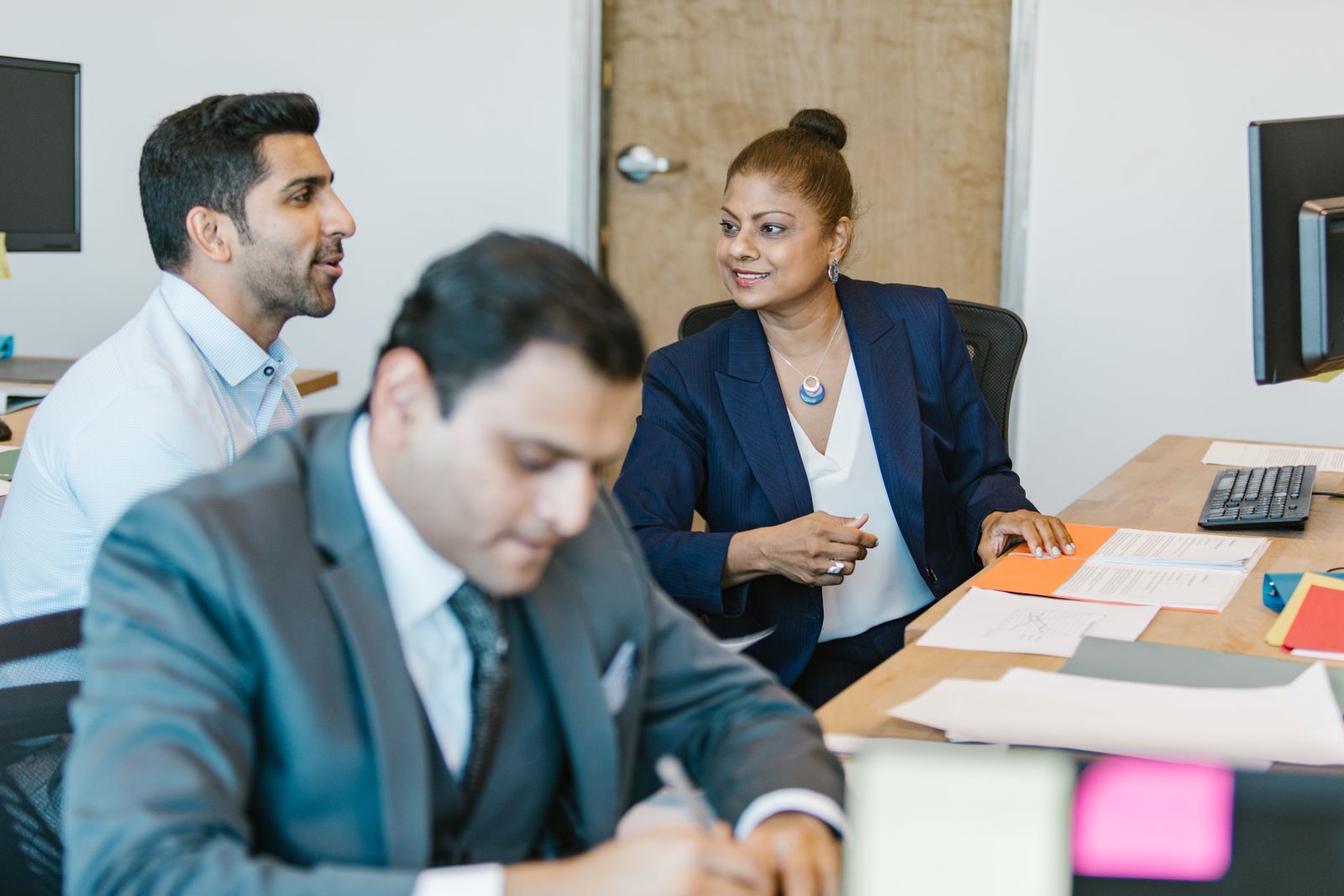 Two colleagues in conversation in an office