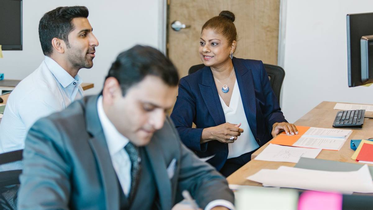 Two colleagues in conversation in an office