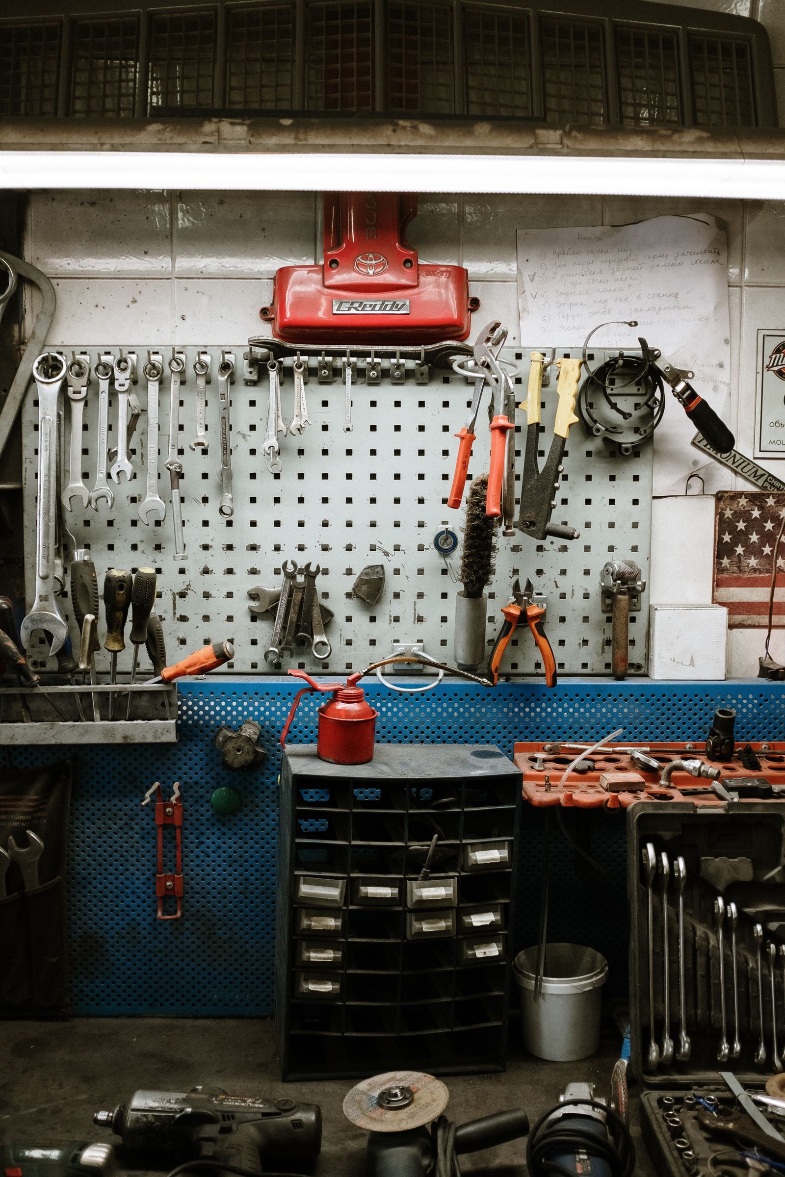 A power tool and hand tools arranged on a workbench