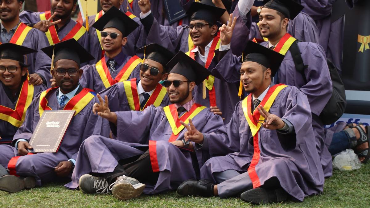 Indian graduates in caps and gowns at a convocation