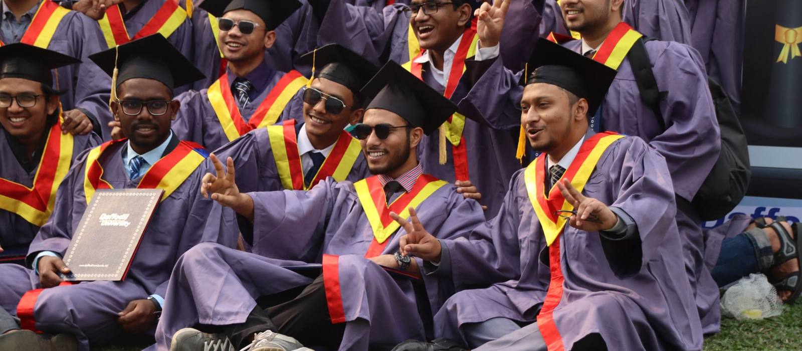 Indian graduates in caps and gowns at a convocation