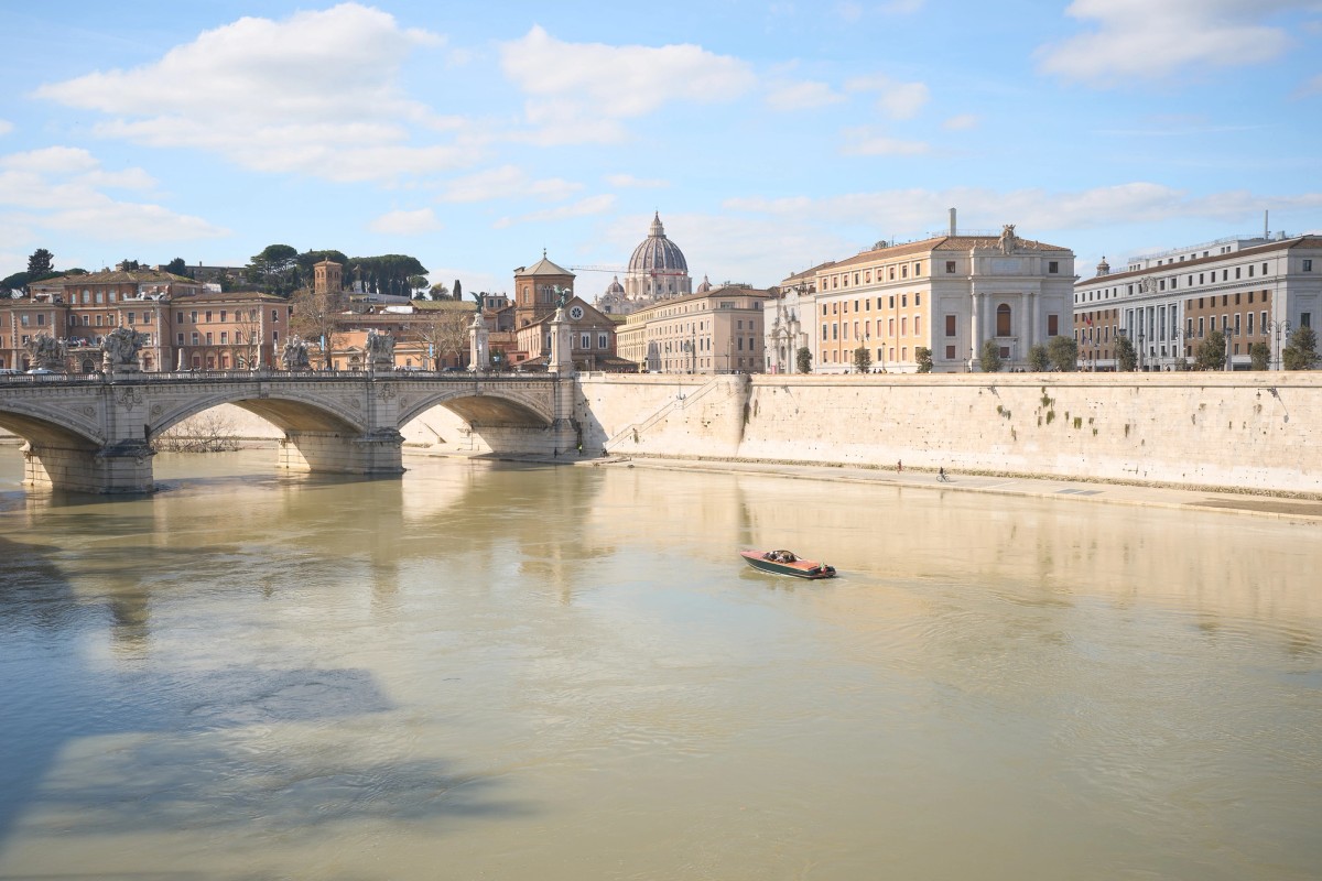 A boat in Rome with the Vatican in the Background