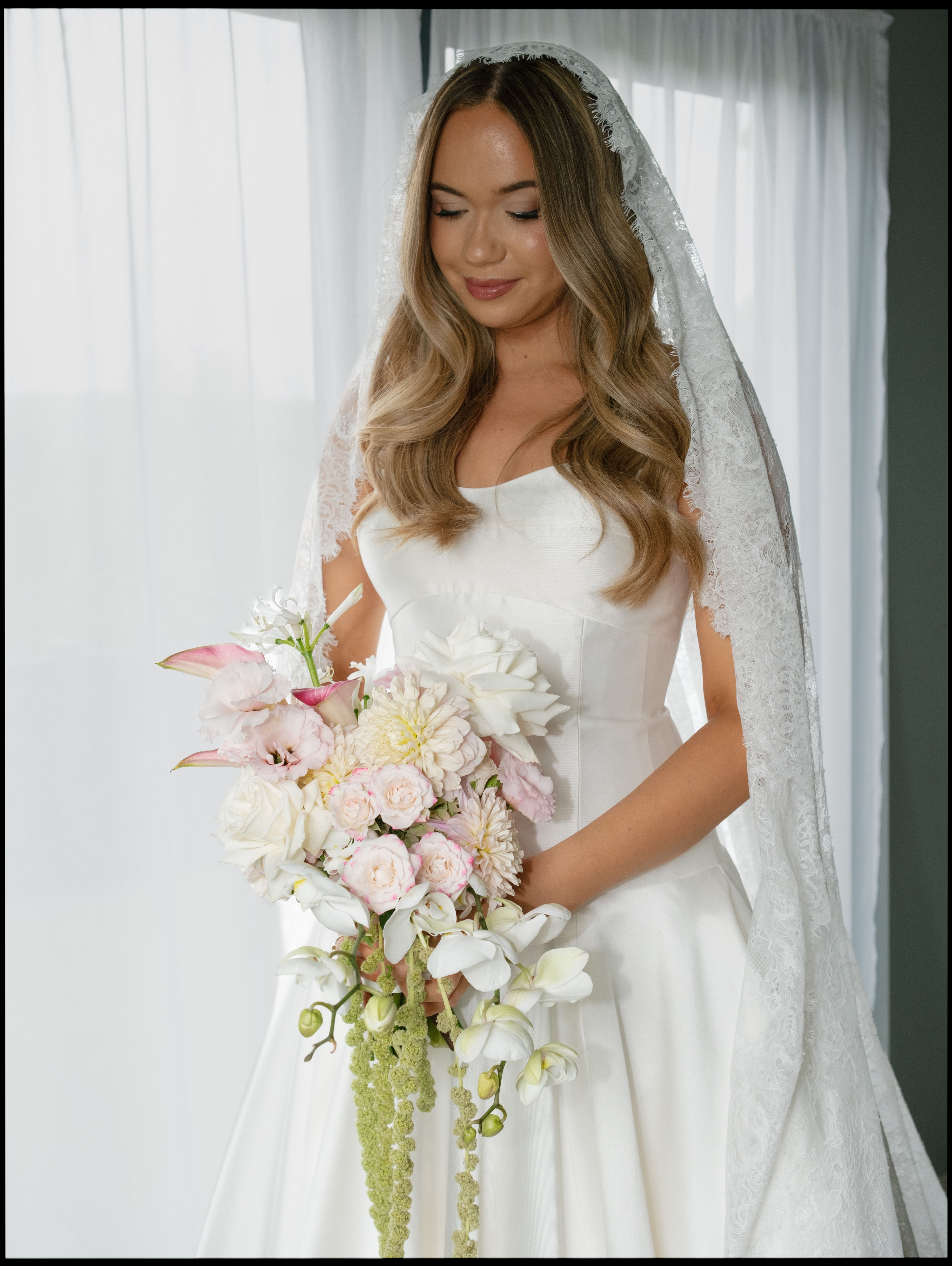 bride posing with her flowers 