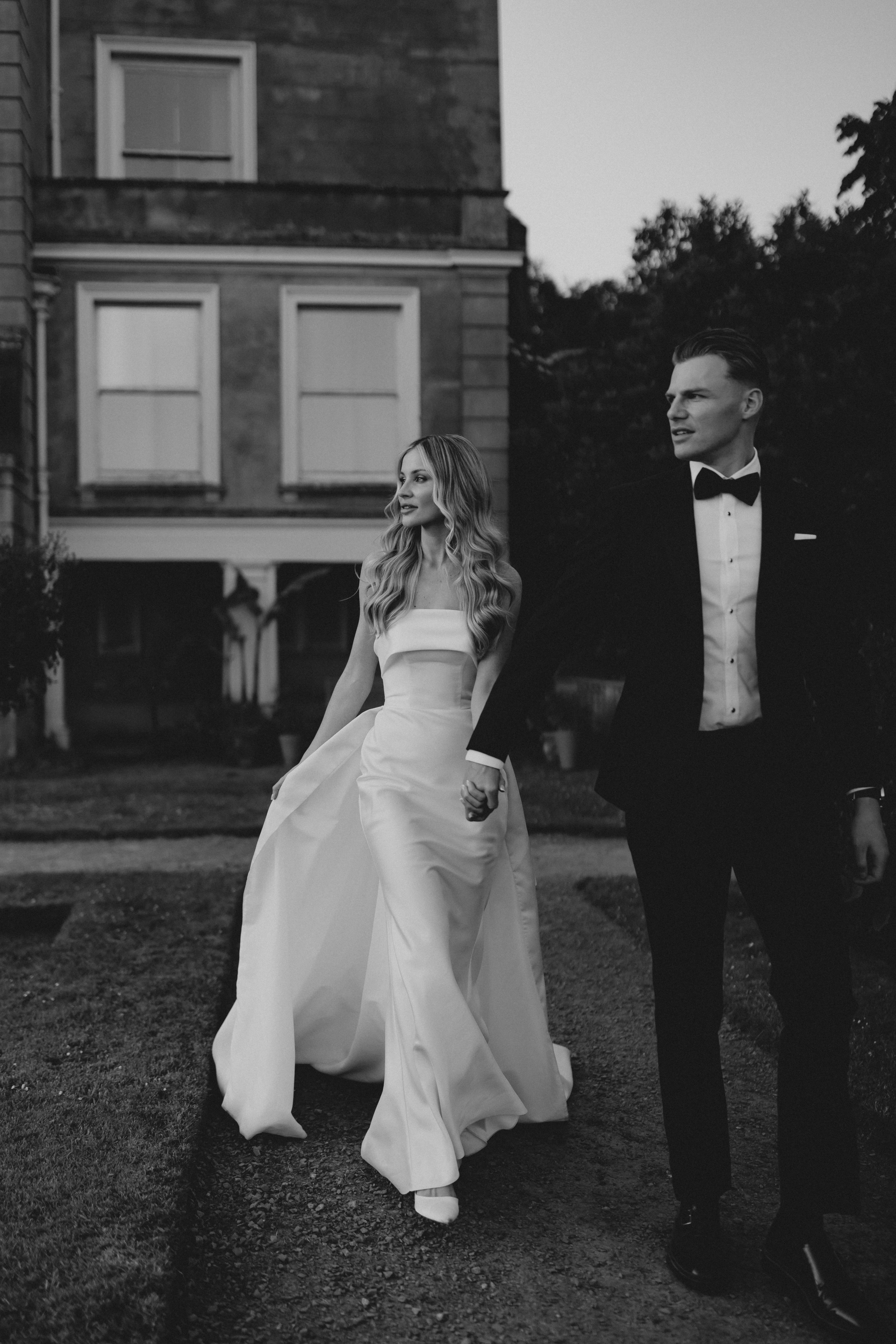 Bride and Groom walking outside the wedding venue