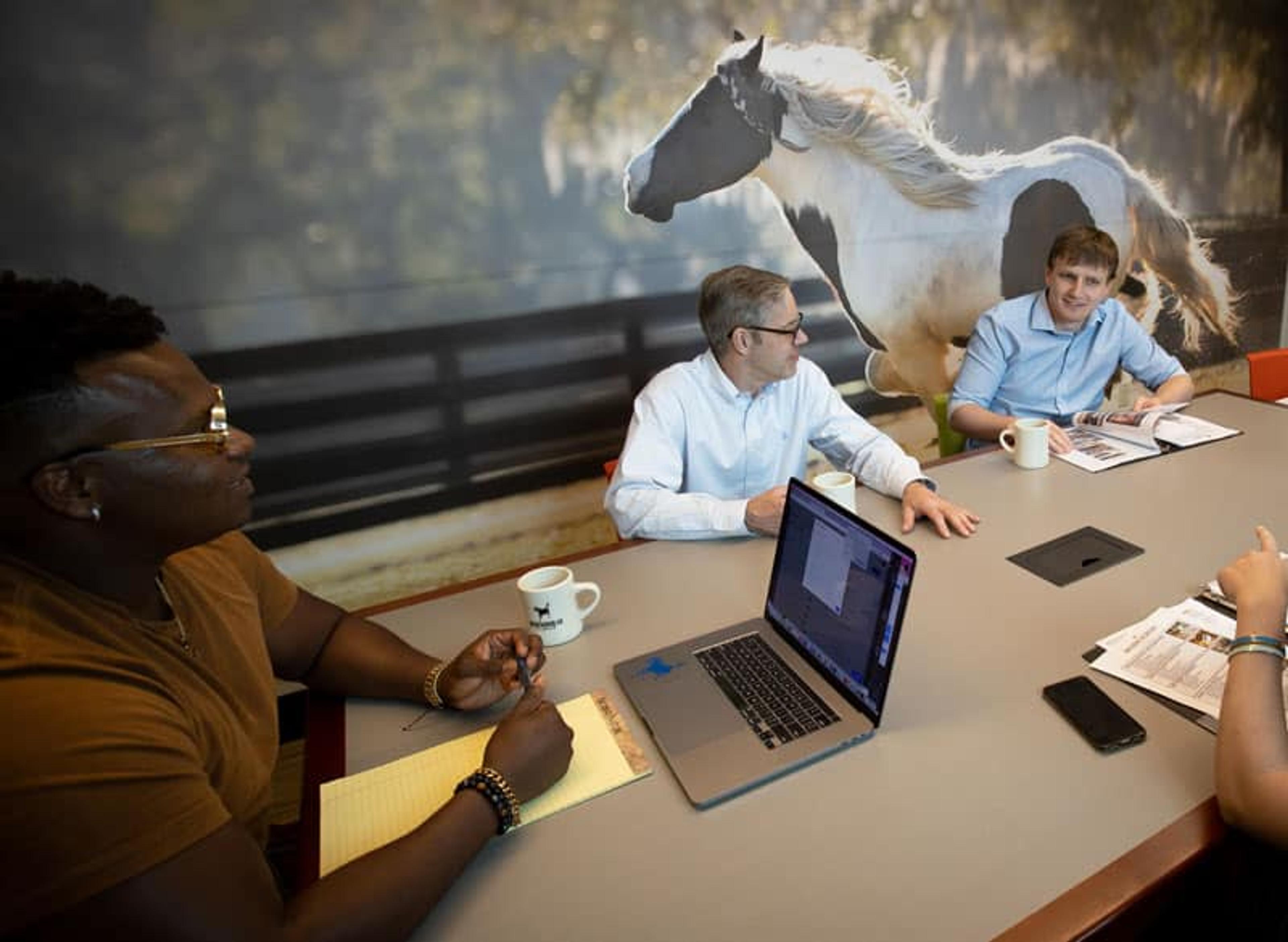 Roundtable discussion team offsite at Workhorse Coworking
