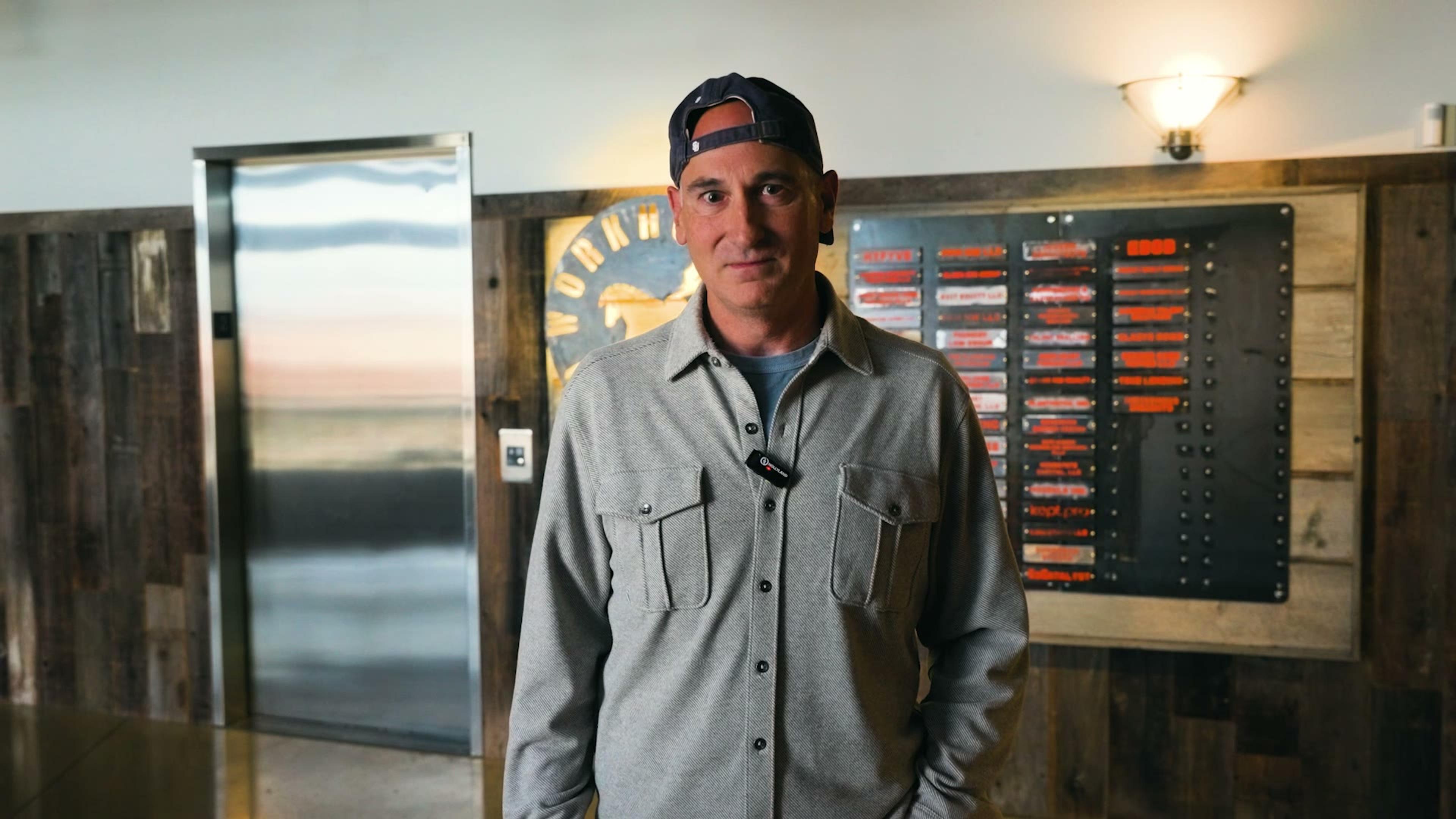 Larry, Workhorse's owner, giving a nod in front of the Workhorse Coworking sign