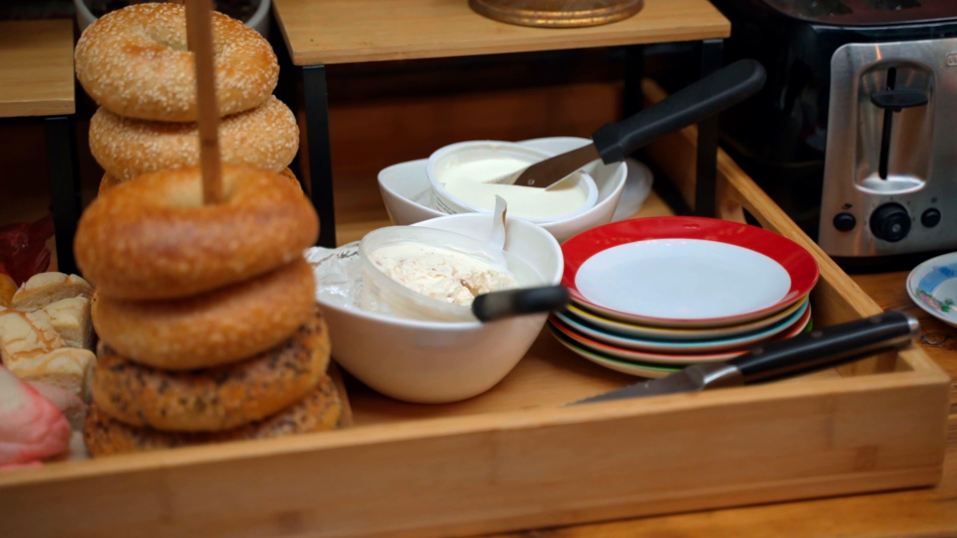 Bagels and Cream Cheese on a table spread