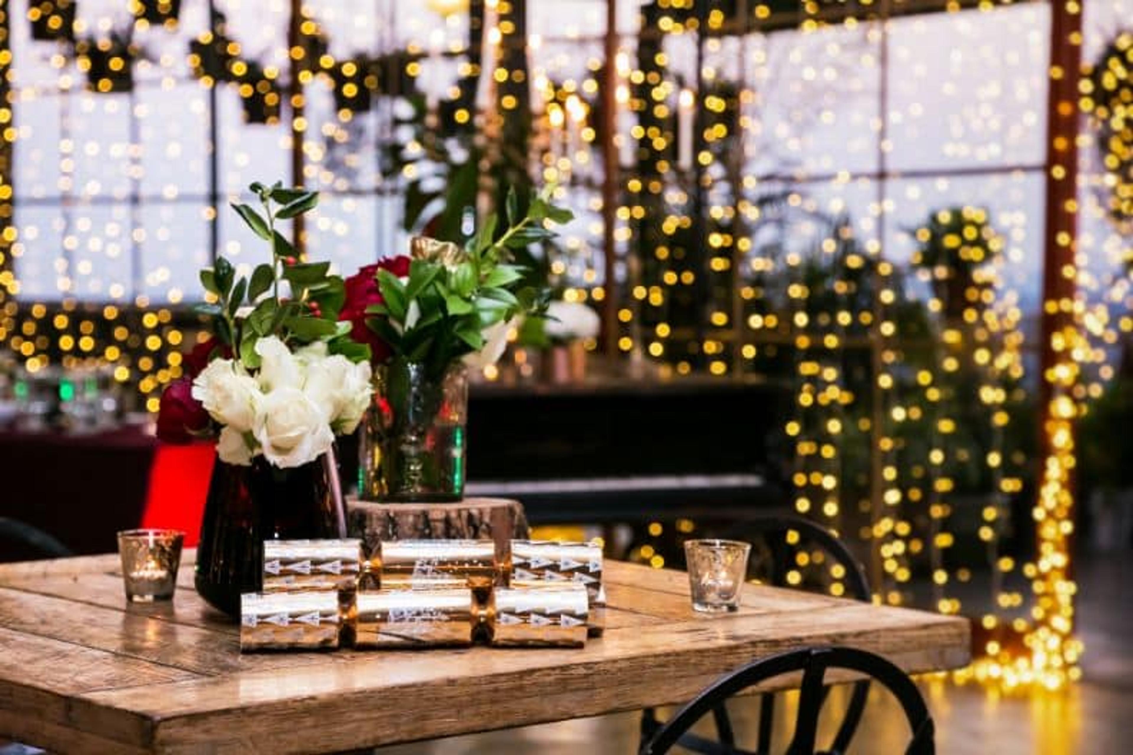 A serene white lit table for a Holiday Party