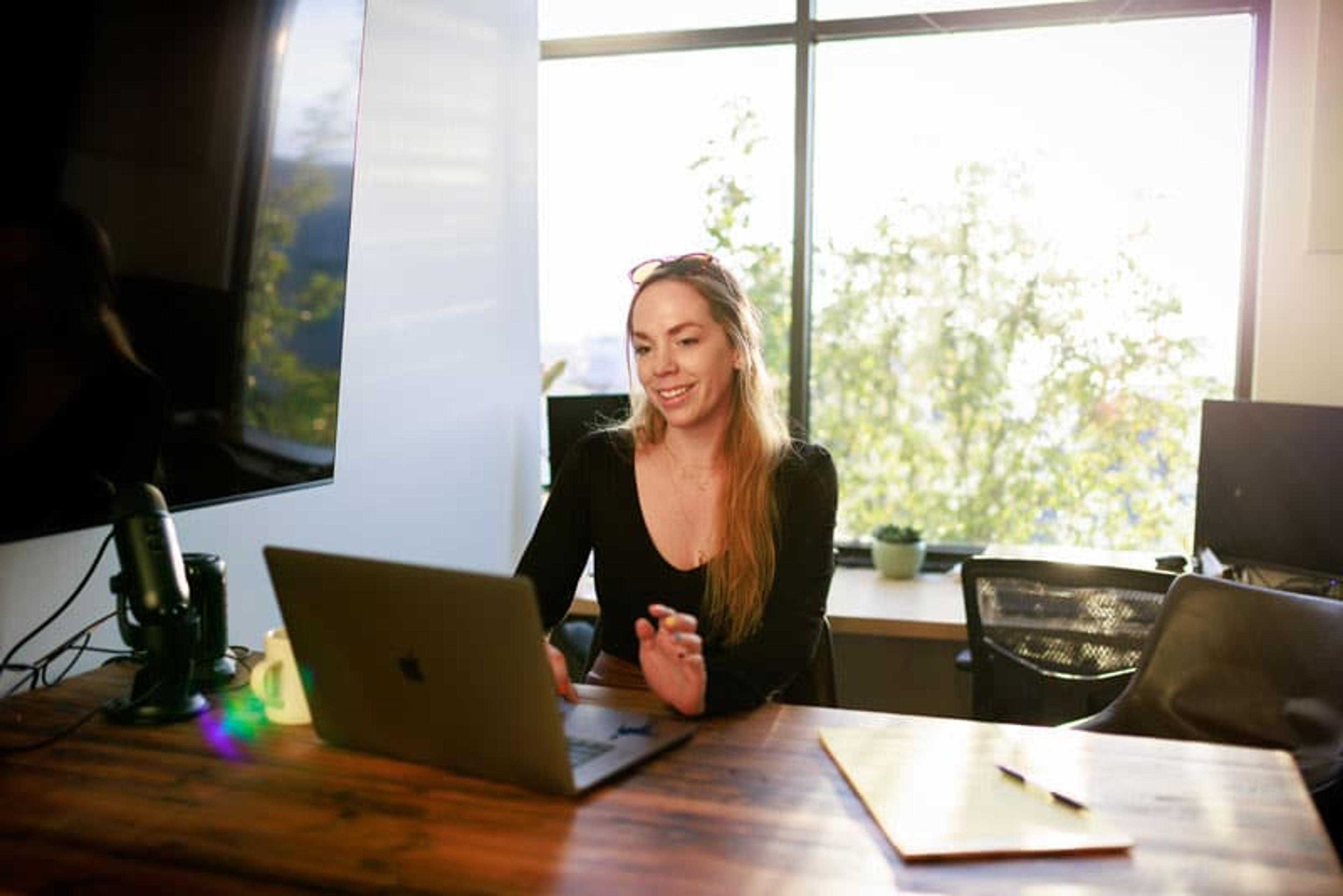 Woman working at desk in private office