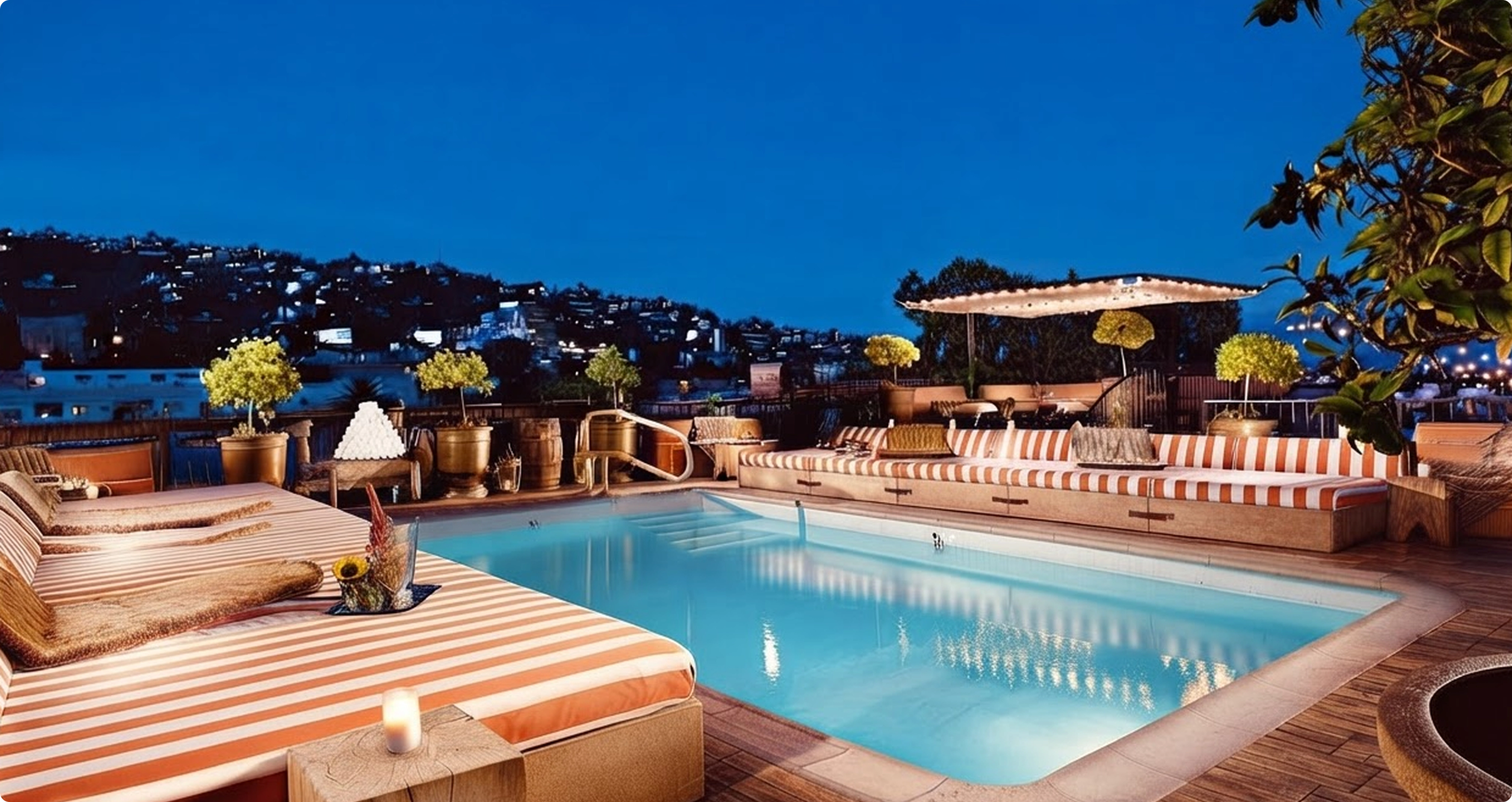 The rooftop pool at Petit Ermitage at dusk