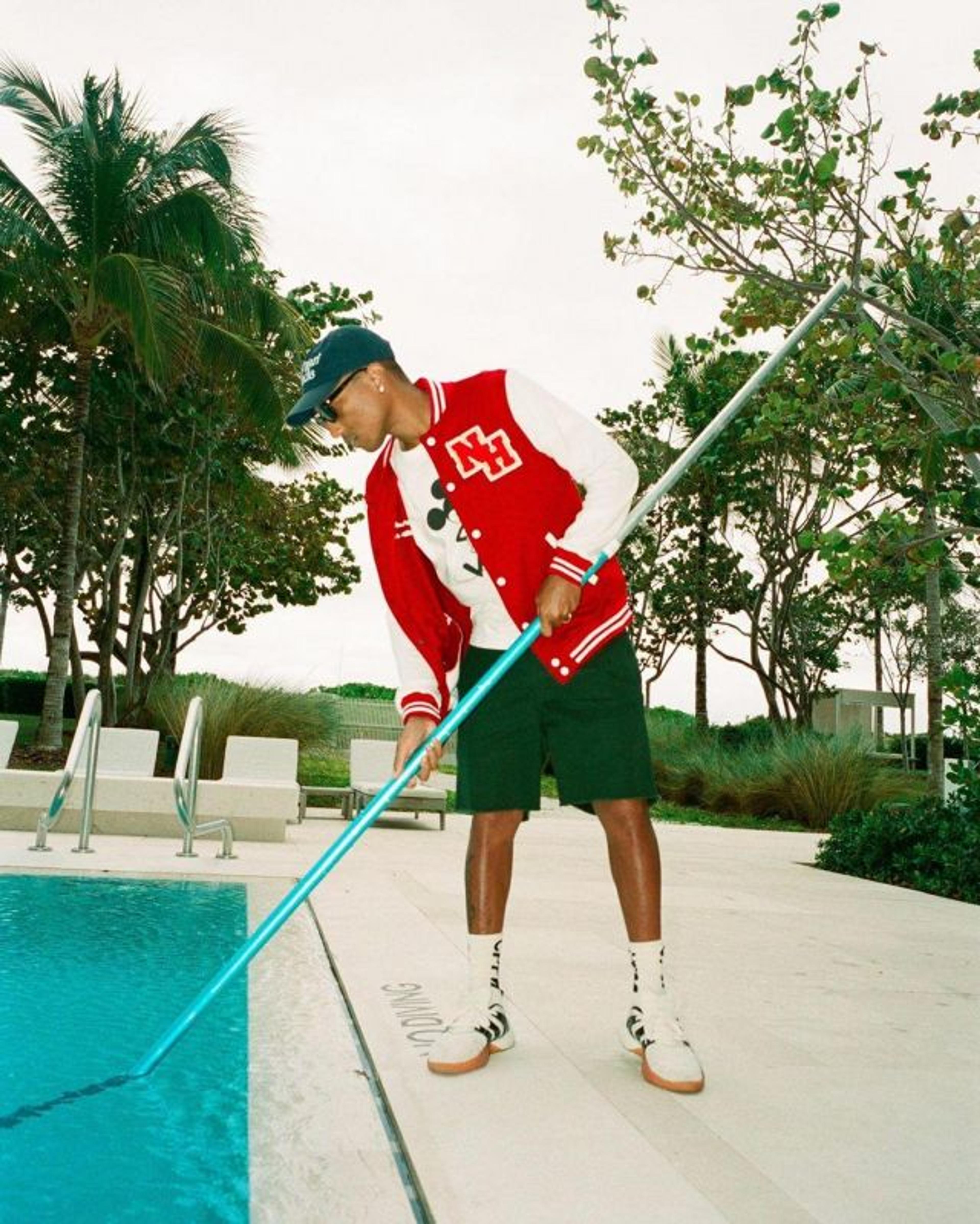 PHARELL LETTERMAN JACKET SKIMMING POOL