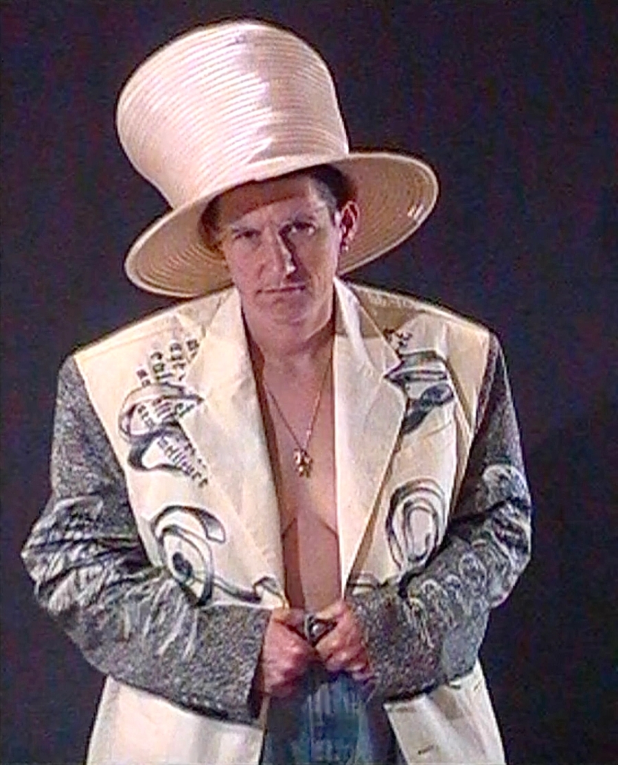 Blazer Jean Paul Gaultier, Trousers Natasha Zinko, Shoes Martine Rose, Hat George Keburia, Necklace Talent’s own