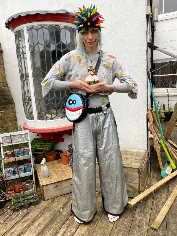 1. Hat: Couch UK - Top: Bernhard Willhelm - Bag: Wild & Lethal Trash - Pants: Altered Mind - Shoes: Suicoke x Vibram x Midorikawa Five Fingers - Orb: Vivienne Westwood x Swatch / 2. Sunglasses: Jameriquai x Oakley Thump - Choker: @alexjustspat - Gloves: Vivienne Westwood - Hoodie: Jeremy Scott - Shirt: Wild & Lethal Trash - Belts: Michiko Koshino, Wild & Lethal Trash, Charles Jefferey Loverboy - Bag: Metamorphose Temps des Fille - Shorts: Waler van Beirendonck - Pants: Takuya Angel - Shoes: Jeremy Scott