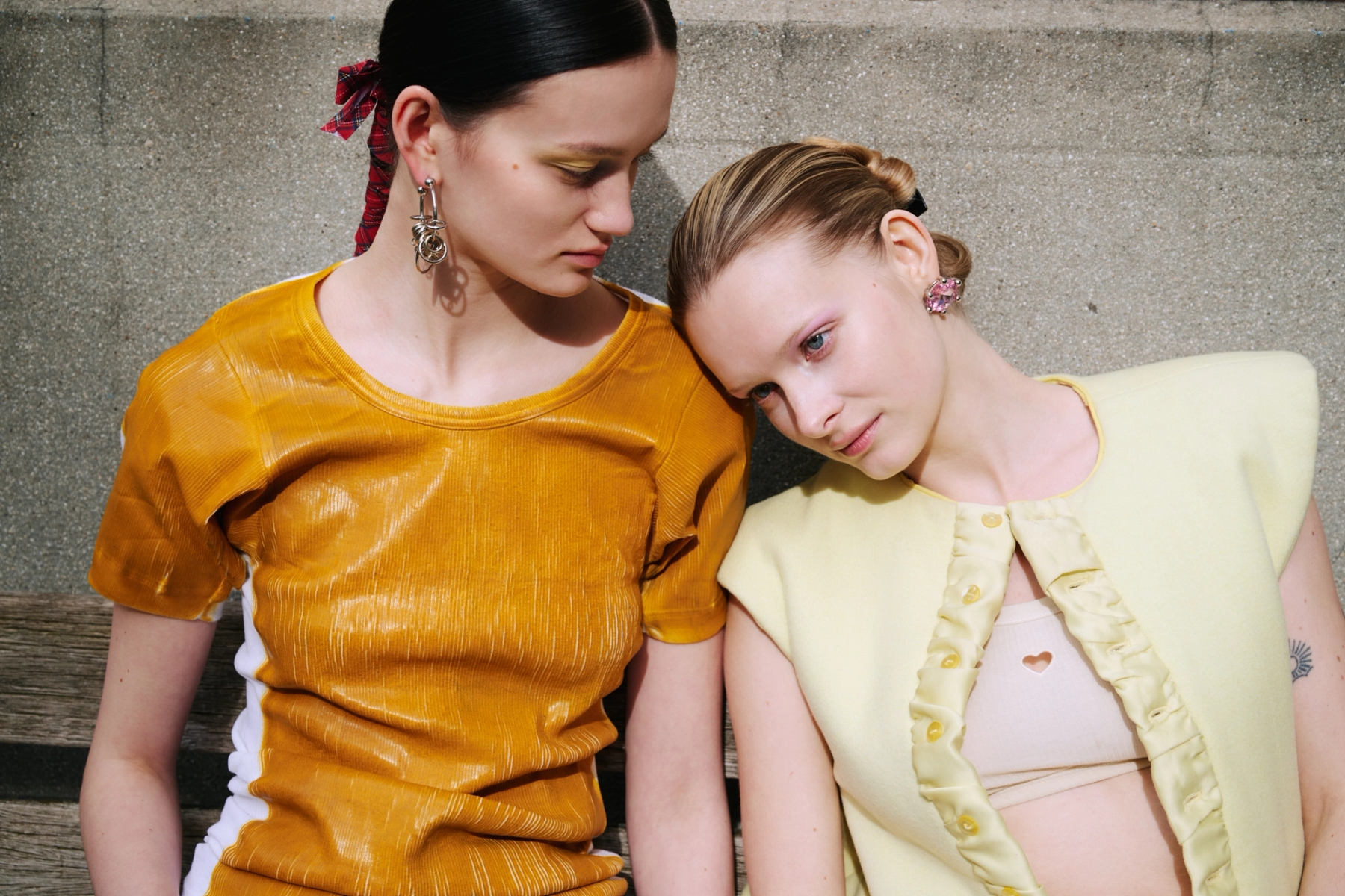 Left to right: Aline in Top Seconda Paris, Trousers Ottolinger, Shoes Casablanca, Earrings Justine Clenquet, Belt Tétier Bijoux x Masha Popova | Katya in Bra Baserange, Jacket Victoire Pedron, Trousers Alexandra Zhukova, Shoes Empty Behavior, Earrings D’Heygere



