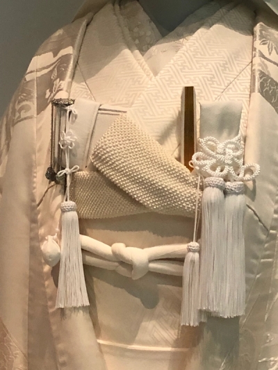 Left: Dress and oni sash, far right: a 'La-La-San' ensemble, both by John Galliano 