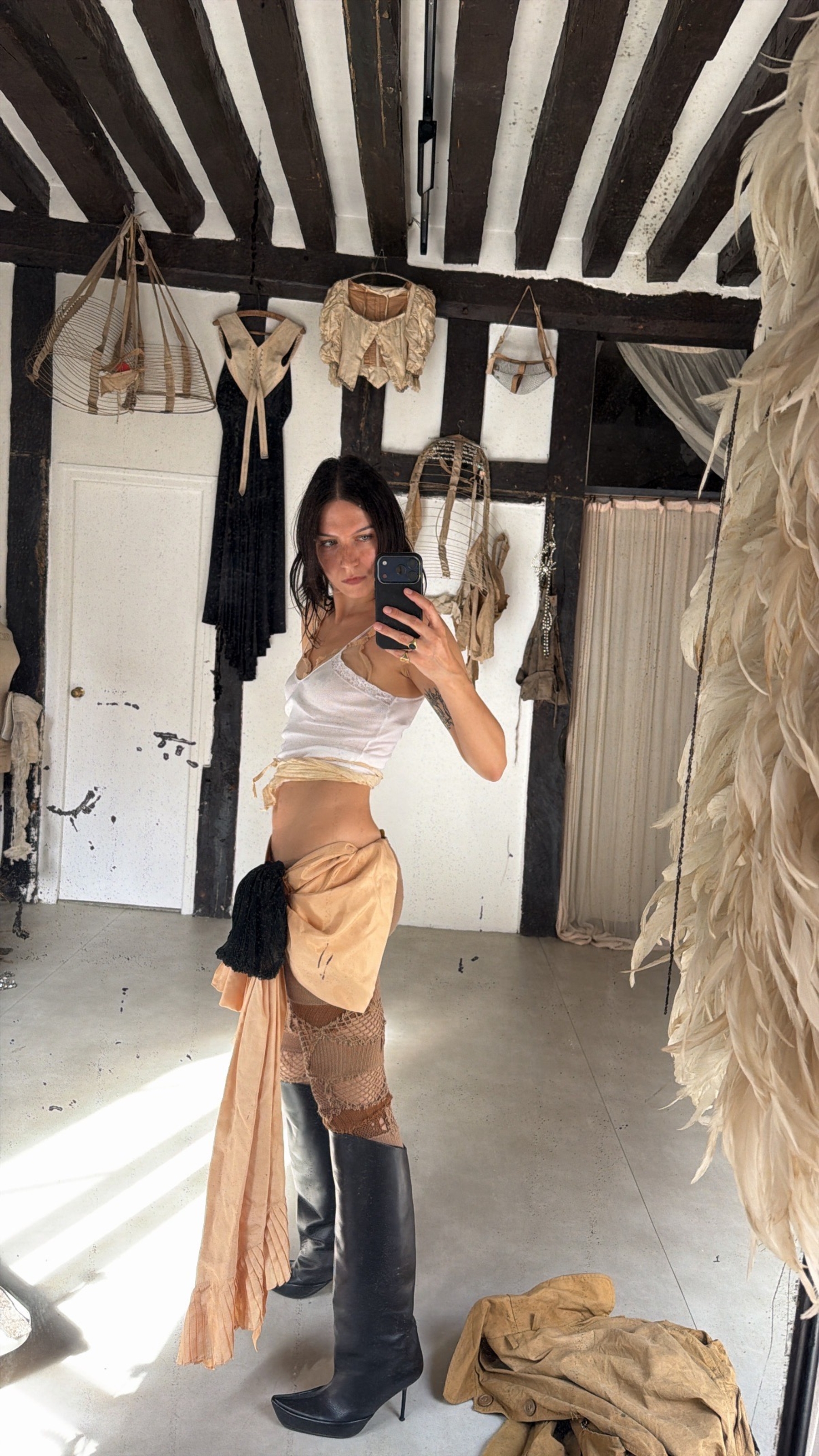 1930s mesh bra worn with antique fabrics wrapped around, 1980s lingerie top, theatrical bustle bow worn as a skirt, knitted leggings Junya Watanabe, shoes Shushuaddict