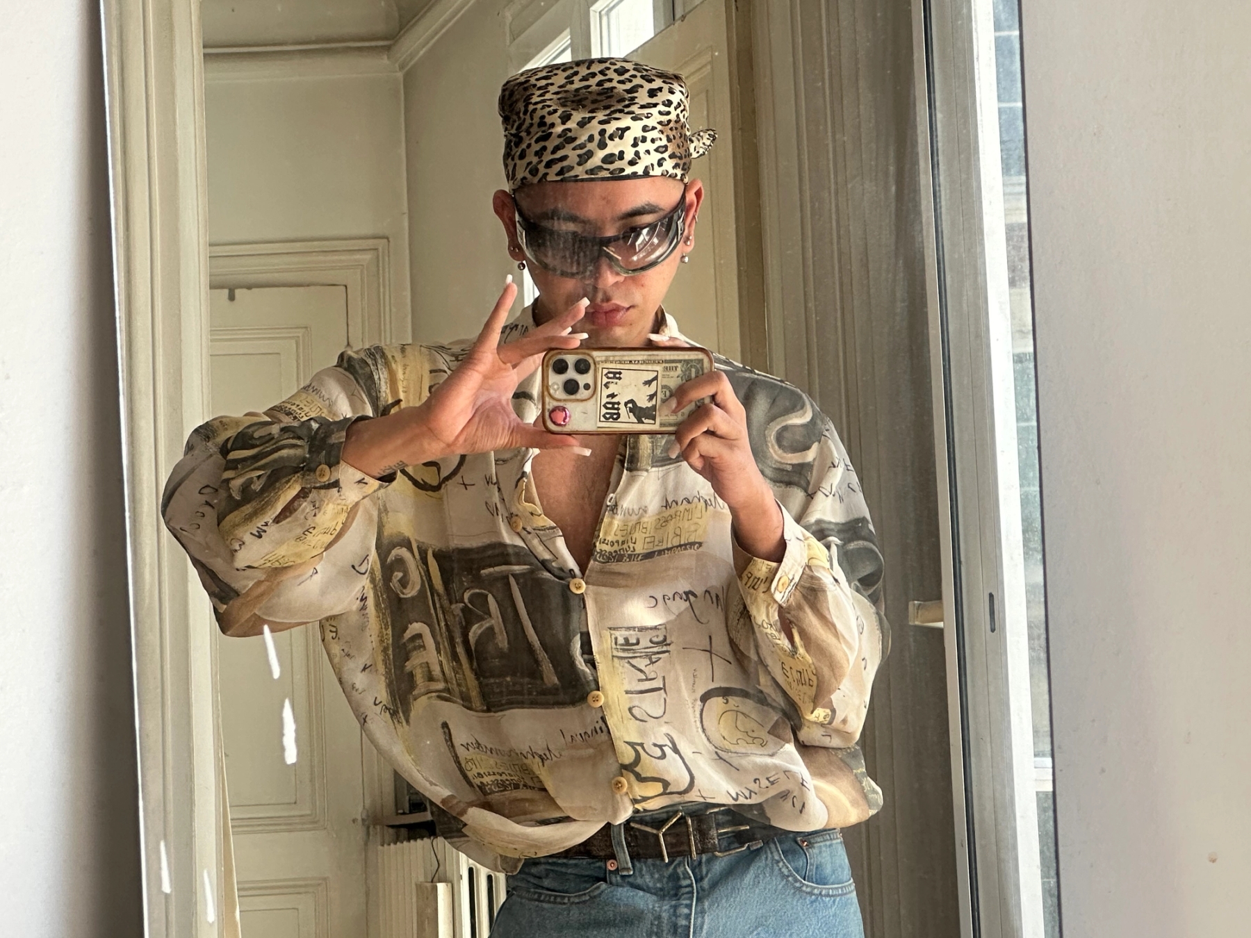 Hat from Luthfi's mom / Sunglasses: Chanel / Belt: Y/Project / Jeans: Balenciaga / Shirt is vintage