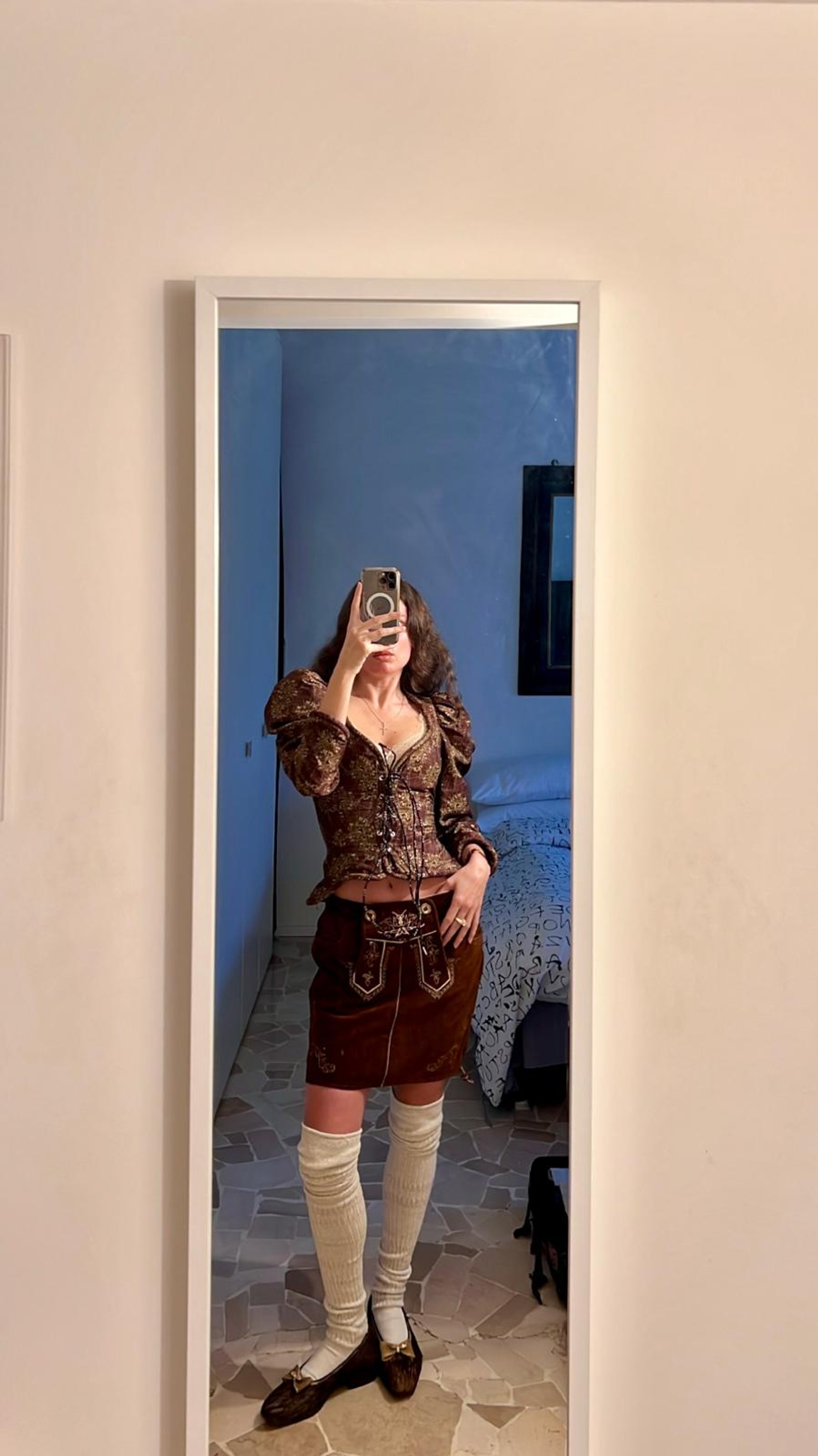 Jacket, Socks and Ballerinas Andreas Kronthaler for Vivienne Westwood, Skirt artisanal Tyrolian, Jewellery her mother’s