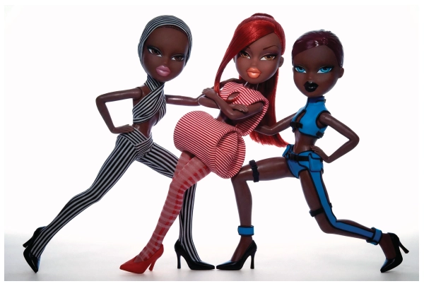 Left to right: Top, Shorts & Sunglasses Jean Paul Gaultier, Tights & Shoes stylist’s own | Top & Skirt Jean Paul Gaultier, Tights & Shoes stylist’s own | Top & Trousers Jean Paul Gaultier, Shoes stylist’s own