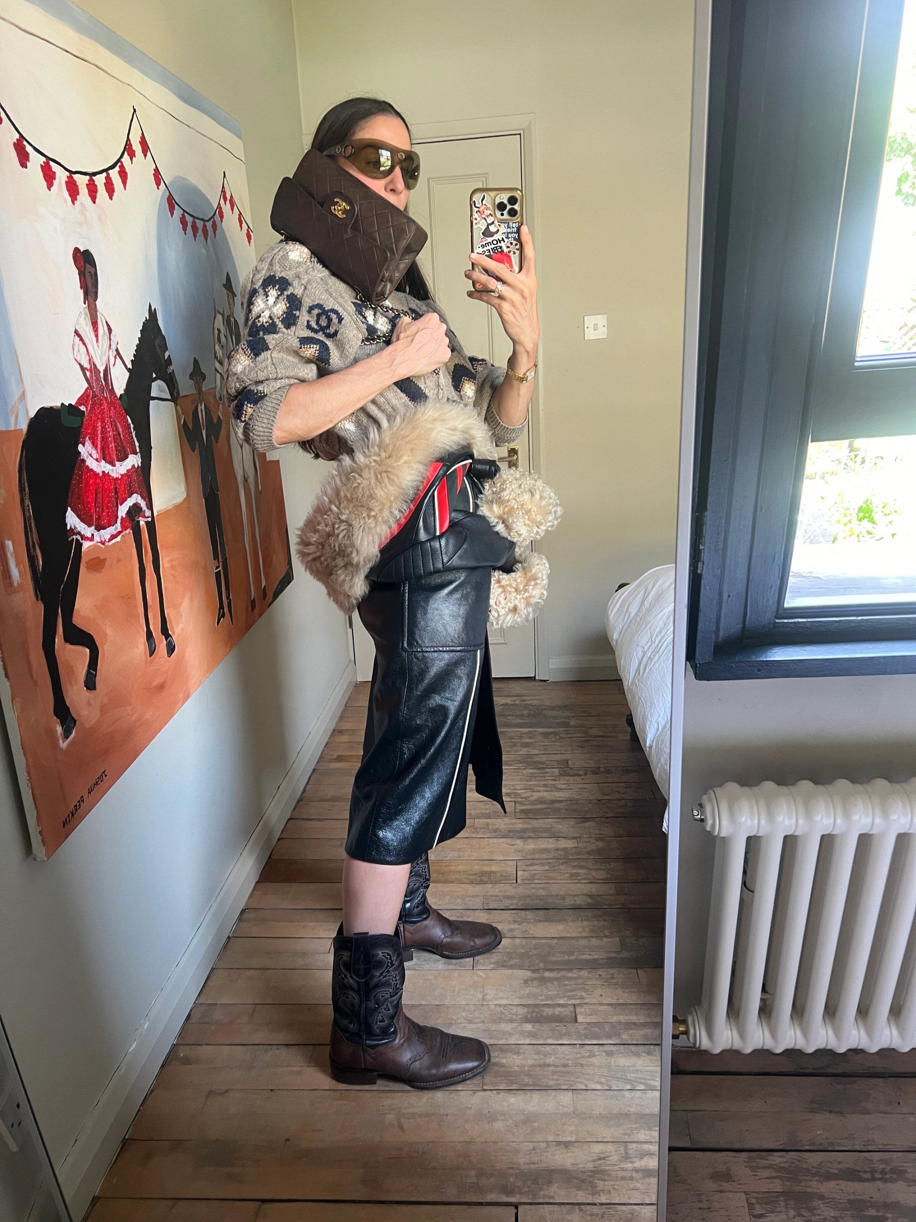 Bag Chanel, Jumper Chanel, Coat Louis Vuitton, Sunglasses Jean Paul Gaultier, Watch Cartier, Boots Vintage