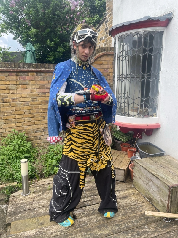 1. Sunglasses: KTZ x Linda Farrow - Jacket: Lee x Vivienne Westwood - Shirt: Wild & Lethal Trash - Undershirt: Cyberdog - Choker: @alexjustspat - Gloves: Vivienne Westwood - Bracelet: Super Sentai Morph Bracelet - Belts: Michiko Koshino, Wild & Lethal Trash, Charles Jefferey Loverboy - Skirt: Moschino Cheap and Chic - Pants: Chor - Shoes: Kiko Kostadinov x Asics / 2. Jacket: Jeremy Scott x Adiddas - Top: Walter van Beirendonck - Belts: Michiko Koshino, Wild & Lethal Trash, Charles Jefferey Loverboy - Skirt: Jeremy Scott - Long Skirt: Hysteric Glamour - Pants: Jeremy Scott x Adidas - Shoes: Doublet x Suicoke - Bag: Ashley Williams - Gloves: Vivienne Westwood