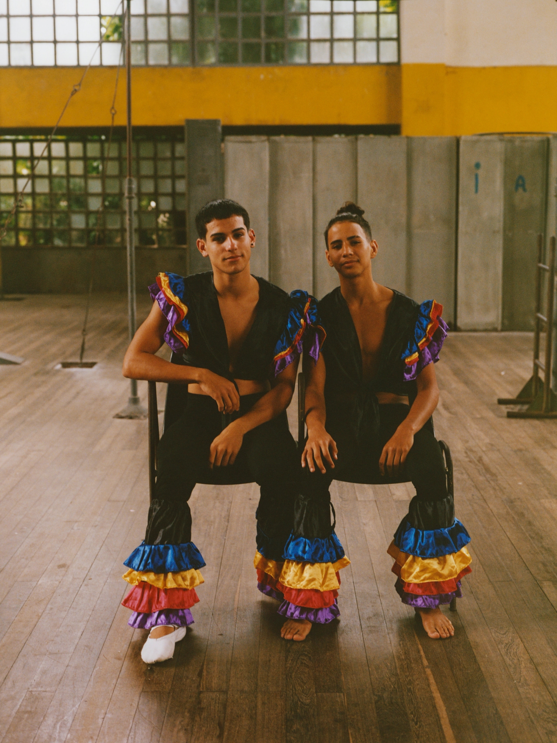 Alejandro Aguilar Izquierdo and Daikel Rafael Rizo Suárez sit for a portrait during a quiet moment after their performance.
