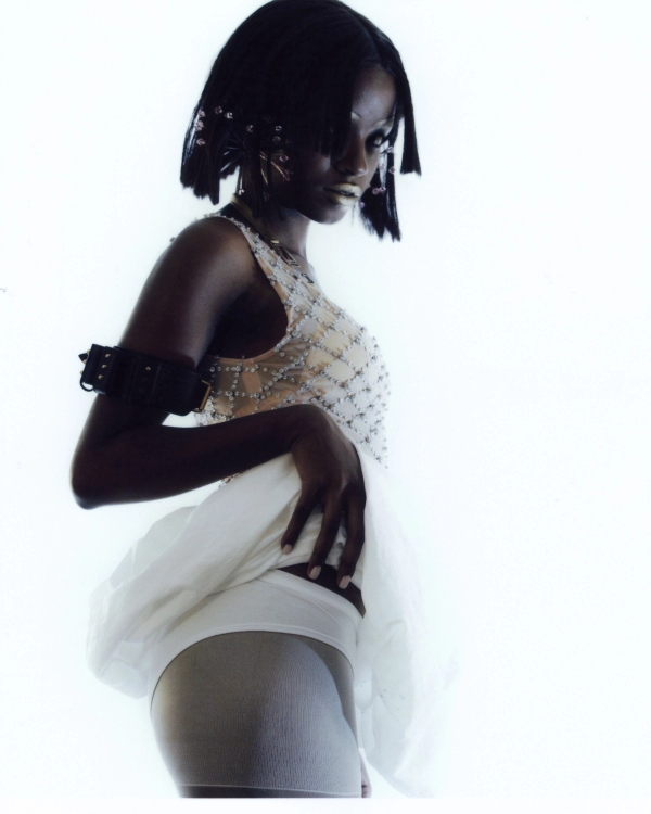 Top No21, bra DOLCE&GABBANA, skirt JIL SANDER, tights 2000Archives, boots GUCCI, bracelets GUCCI, earrings Hugo Kreit