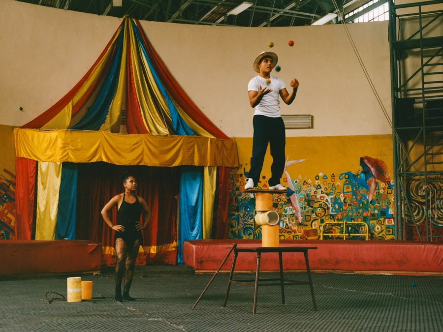 Left to right: Rocío Margaret Barroso Veslasco and Leandro Jorro Peñate perform a paired roller-skating duet routine. | Samanta Collado Valdés and Daniel Enrique Vale Naya perform a juggling and balancing routine. In Cuba, juggling and balance are among the first circus skills taught, forming the basis for more complex acts.

