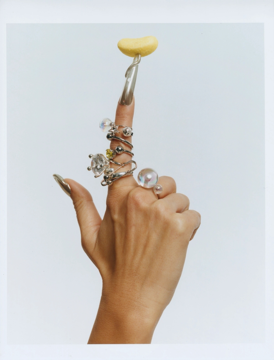 Rings: La Môme Bijou, Jimmy Choo, Justine Clenquet, Panconesi / Bracelet worn as a ring: Panconesi 