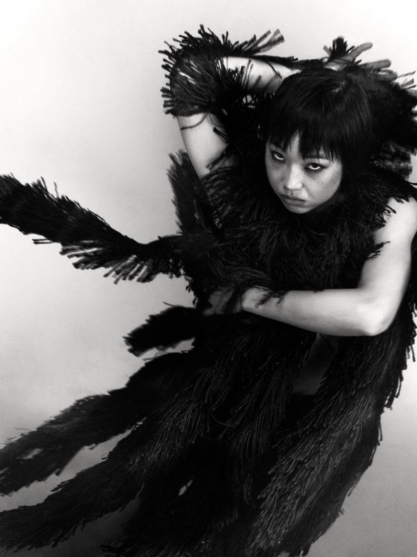 Emiri in Top & Skirt Alaïa, Socks stylist’s own, Shoes Vagabond, all Jewellery model’s own