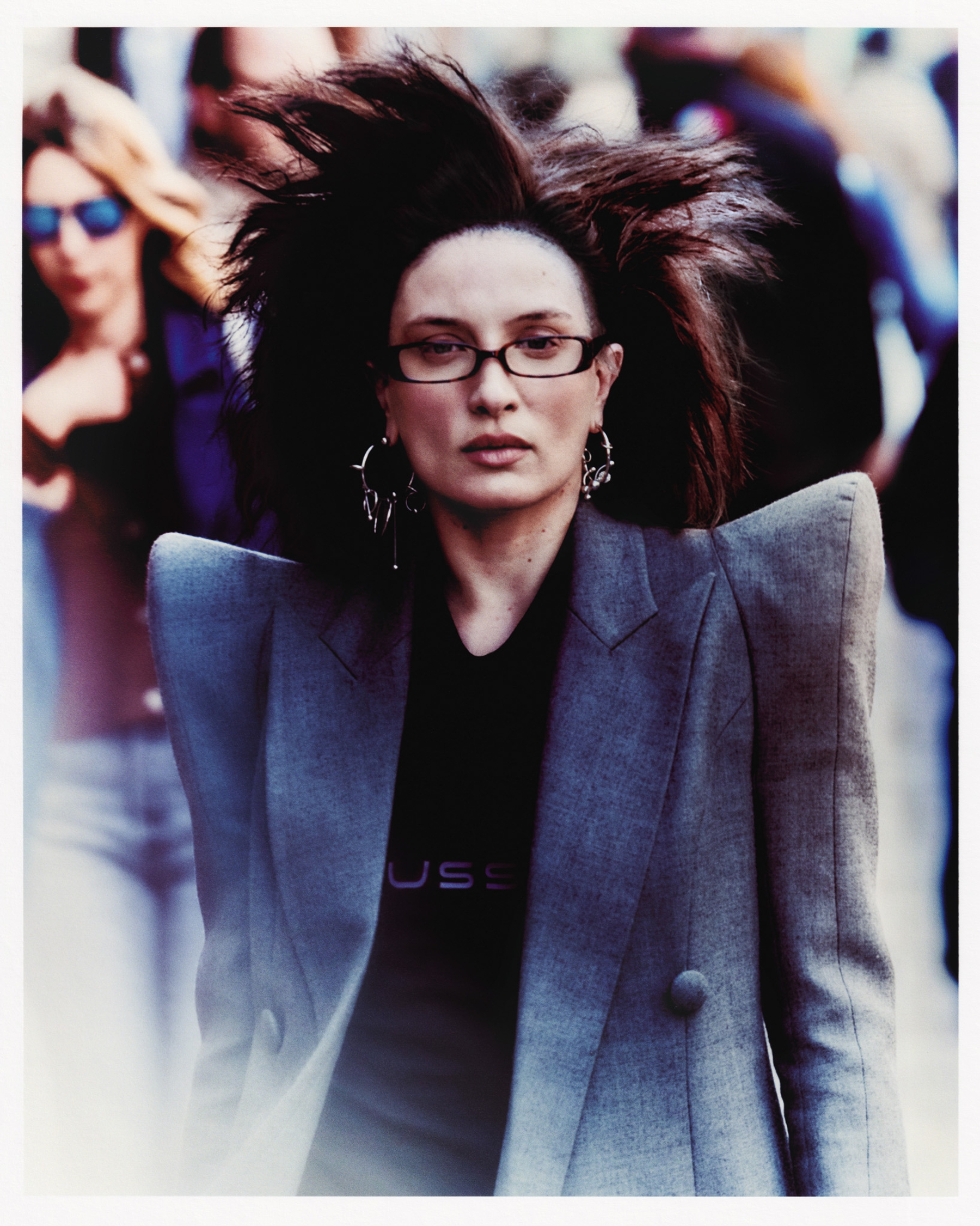 Top Mowalola, Jacket Balmain, Glasses talent’s own, Earrings Justine Clenquet