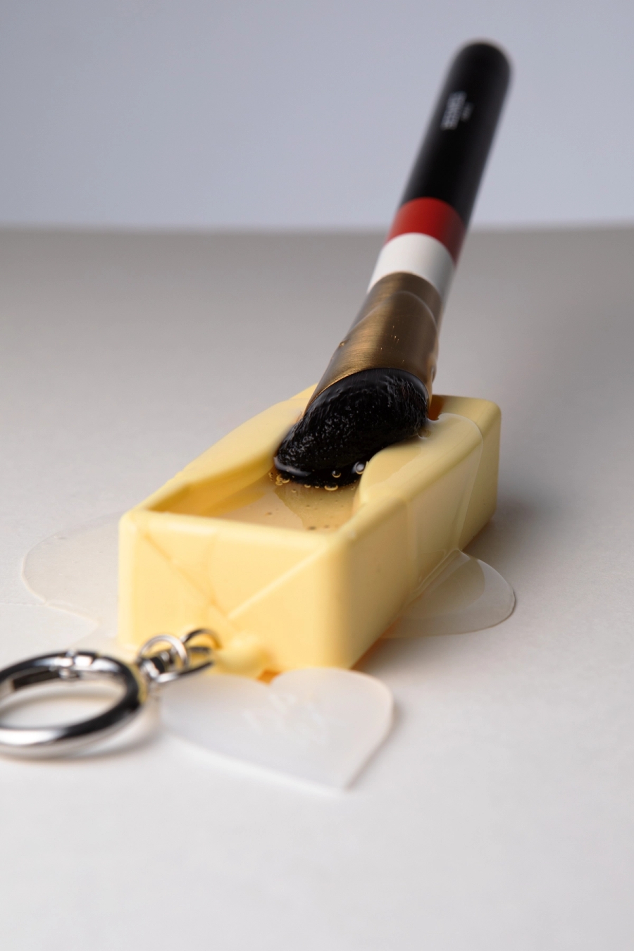 Left to right: Pinkwonder My Lip Butter Keyring & Jojoba Lipbutter | Hermès Foundation Brush