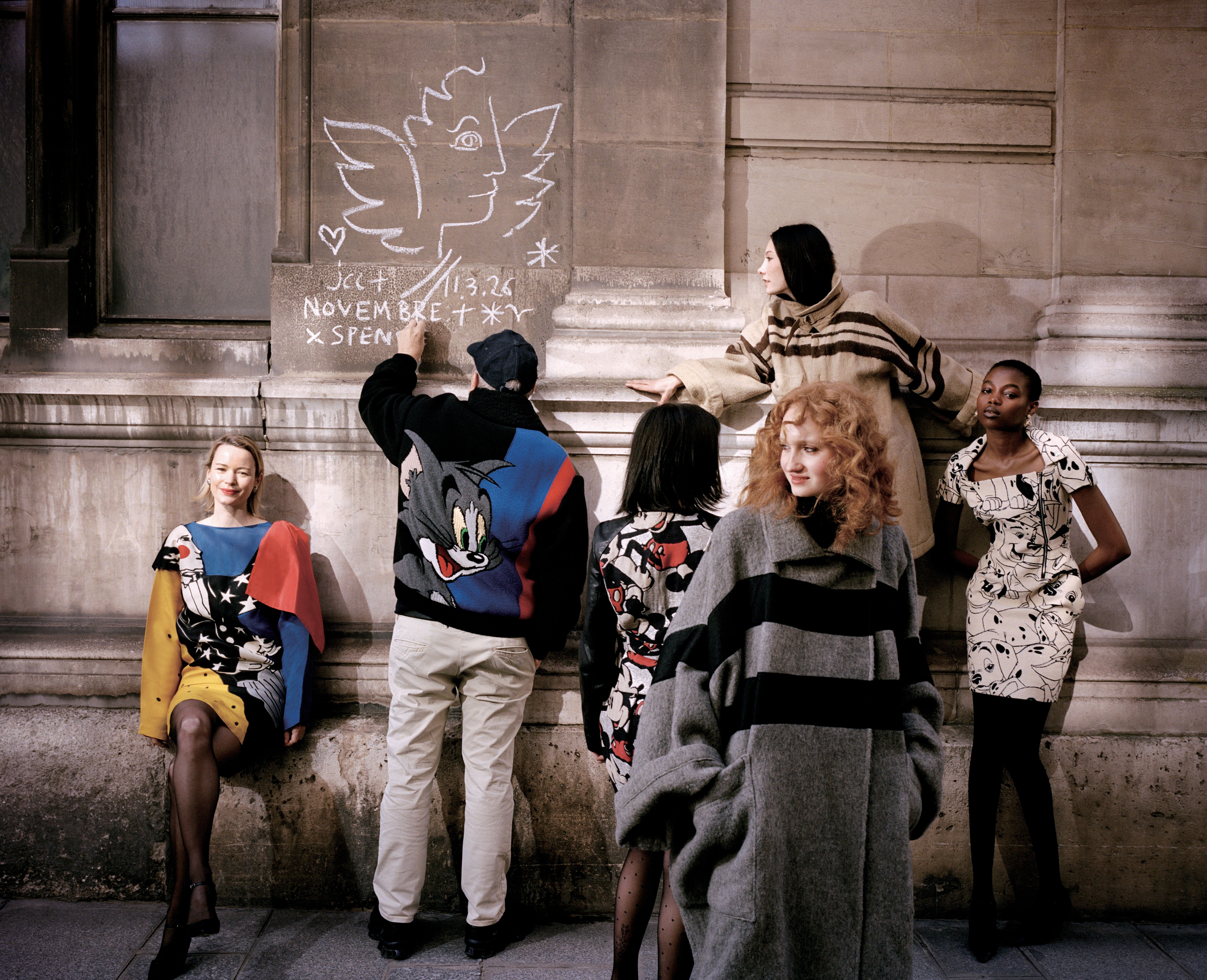 
Left to right: Pauline wears Magician Dress 1988 Jean-Charles de Castelbajac Archive, Tights stylist’s own, Shoes Manolo Blahnik | Jean-Charles wears all clothes his own | Agathe wears Jacket Mickey Jean-Charles de Castelbajac Archive, Skirt Mickey Jean-Charles de Castelbajac Archive, Tights Stylist’s own, Shoes Amina Muaddi | Chloe wears Coat Archives Défilé JCC AH 1977-1978 Jean-Charles de Castelbajac Archive, Bodysuit Falke, Jeans Guess, Boots Vintage Chanel from Amo Vintage | Anya wears Coat Archives Défilé JCCAH 1977-1978 Jean-Charles de Castelbajac Archive, Jeans Guess Jeans x Hysteric Glamour, Shoes Vintage Prada from Amo Vintage | Rose wears Dress Défilé JCC AH 2011-2012 Woman Ray Jean-Charles de Castelbajac Archive, Tights Stylist’s own, Shoes Manolo Blahnik, Earrings 4Element