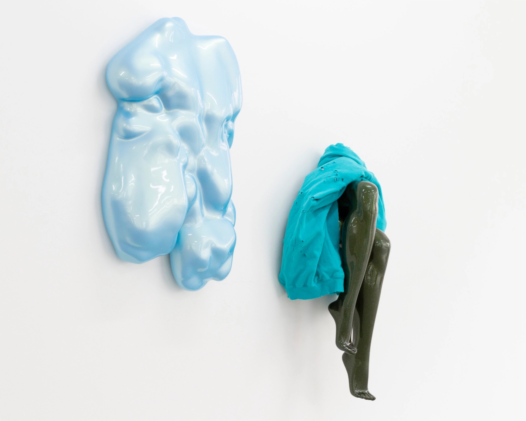 Left to Right: 'Wow 7' 2008, Rigid polyurethan foam, plaster, fiberglass, lacquer / 'Sono Tua, Lucio!' 2021, Fiberglass, sweatshirt