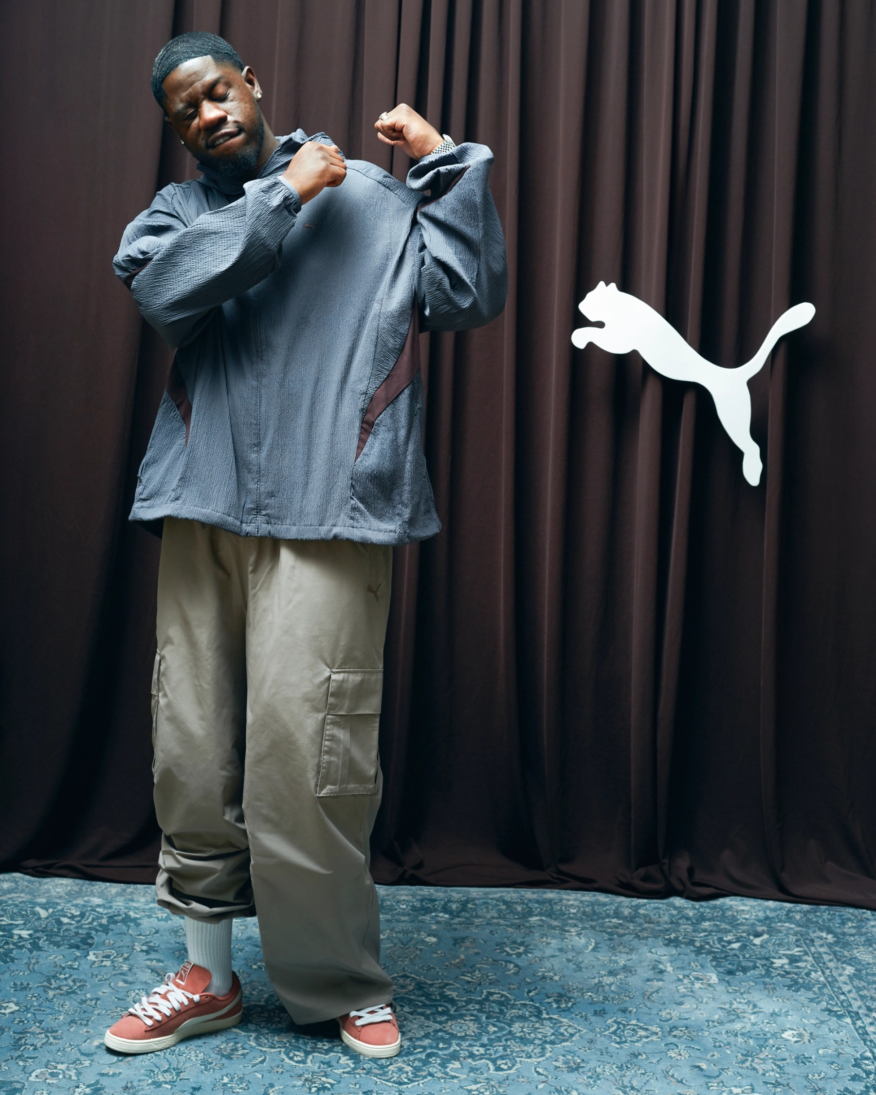 Jacket, Tracksuit Pants & Shoes Puma, Tank Top stylist’s own, Jewelry & Watch talent’s own