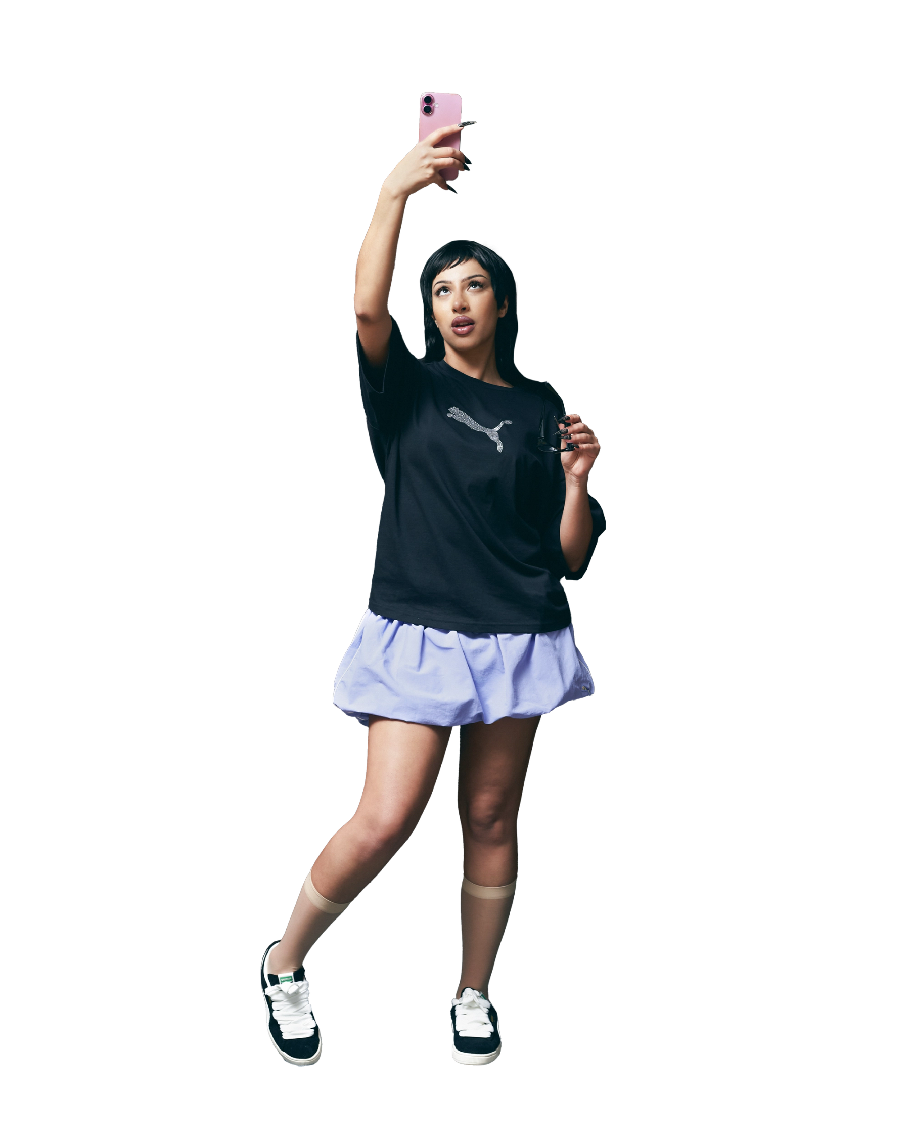 T-shirt, Skirt & Shoes Puma, Socks stylist’s own, Glasses talent’s own  
